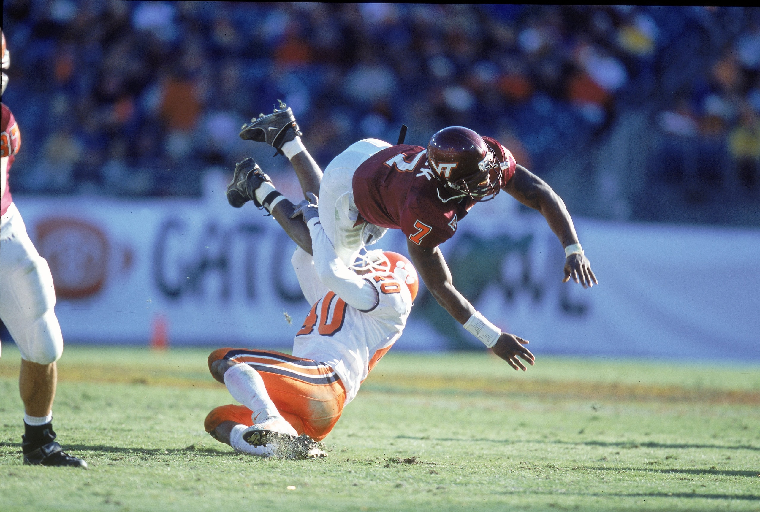 1 Jan 2001:  Quaterback Michael Vick #7of the Virginia Tech Hokies is tackled by Charles Hafley #40 of the Clemson Tigers during the Gator Bowl Game at the Gator Bowl in Jacksonville, Florida.  The Hokies defeated the Tigers 41-20.Mandatory Credit: Craig 