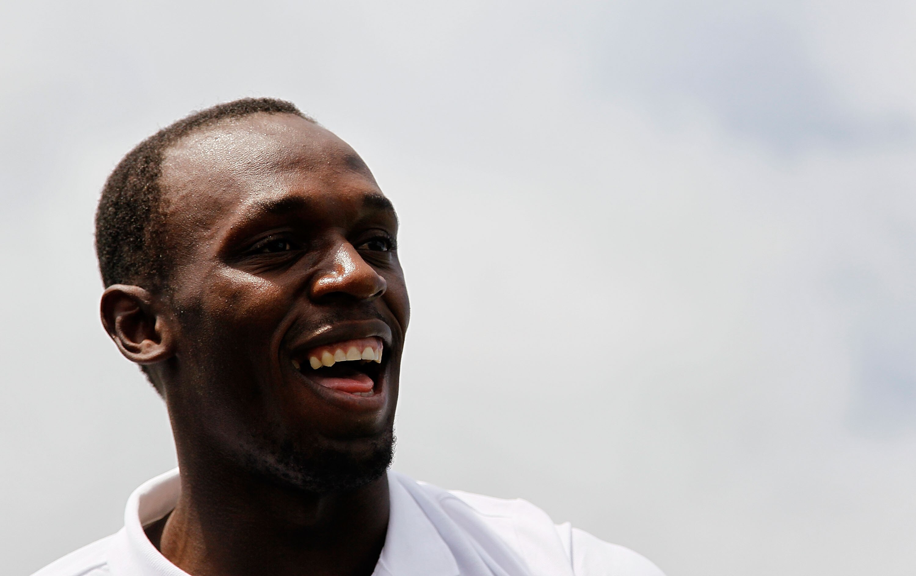 MONTEGO BAY, JAMAICA - APRIL 16:  Usain Bolt reacts to his shot into the Caribbean Sea during the quarterfinal matches of The Mojo 6 Jamaica LPGA Invitational at Cinnamon Hill Golf Course on April 16, 2010 in Montego Bay, Jamaica.  (Photo by Kevin C. Cox/