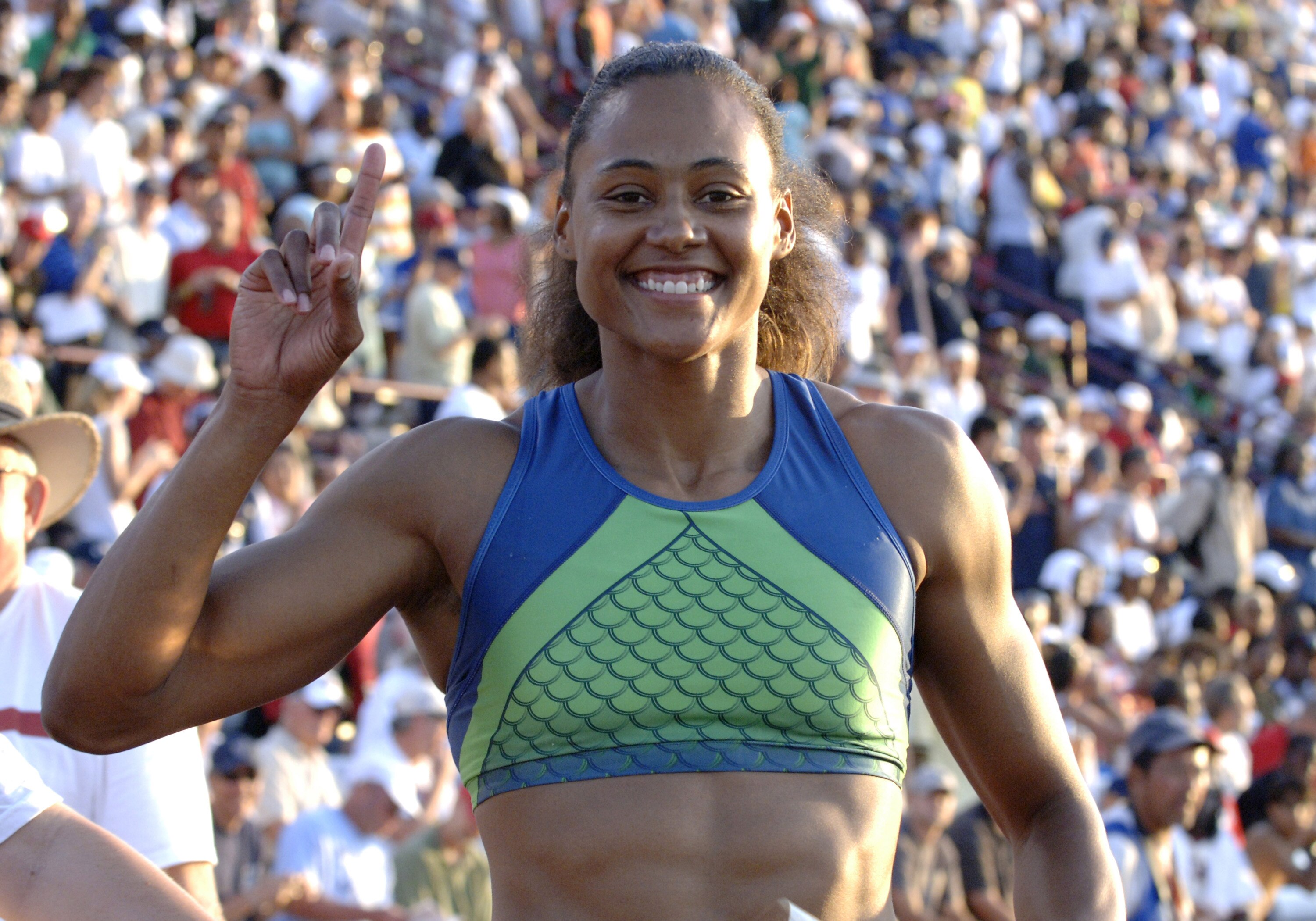 Marion Jones wins the women's 100-meter dash June 23 at the 2006 AT&T Outdoor Track and Field Championships in Indianapolis. (Photo by A. Messerschmidt/Getty Images)
