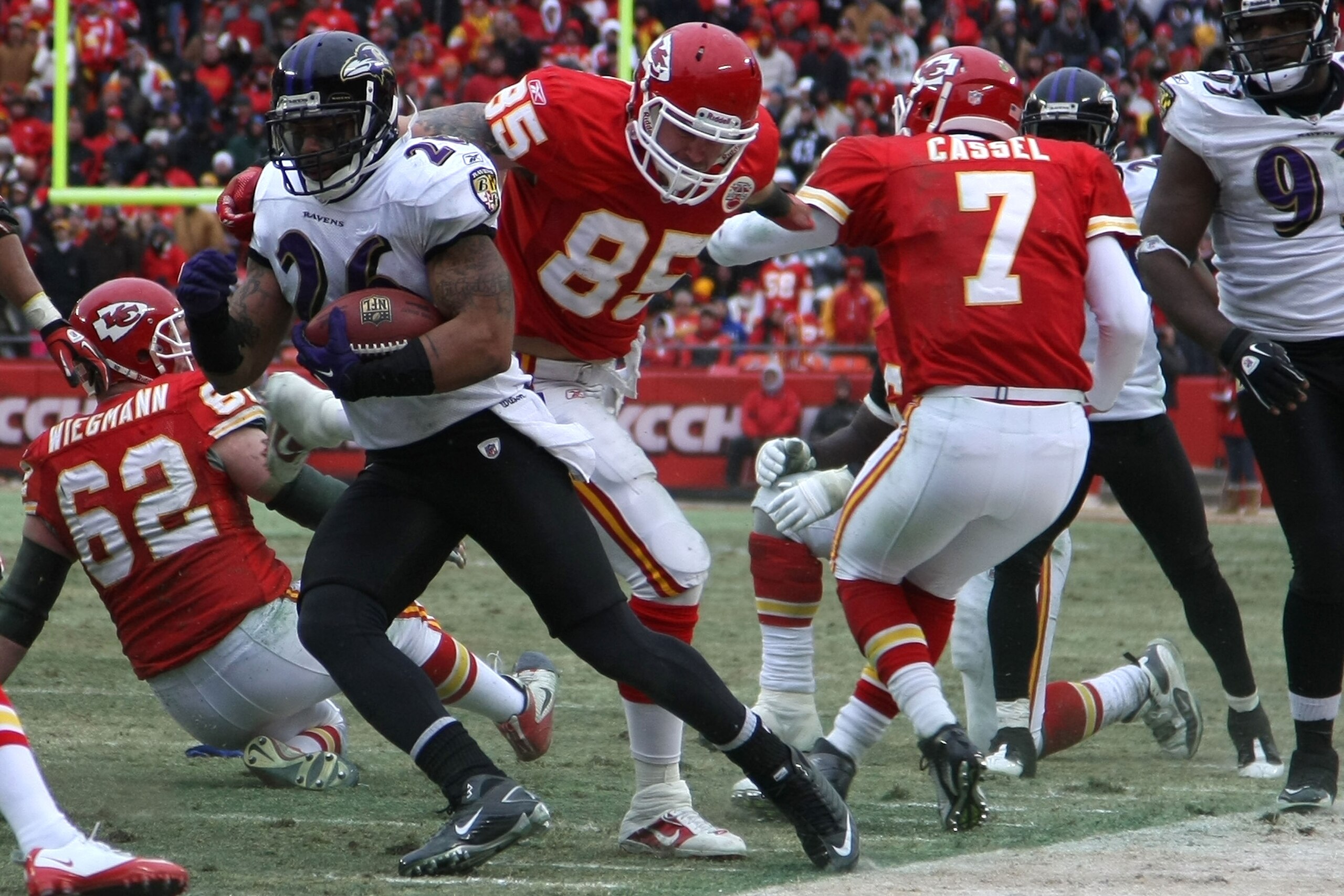 KANSAS CITY, MO - JANUARY 09:  Safety Dawan Landry #26 of the Baltimore Ravens runs back an interception of quarterback Matt Cassel #7 of the Kansas City Chiefs in the third quarter of their 2011 AFC wild card playoff game at Arrowhead Stadium on January