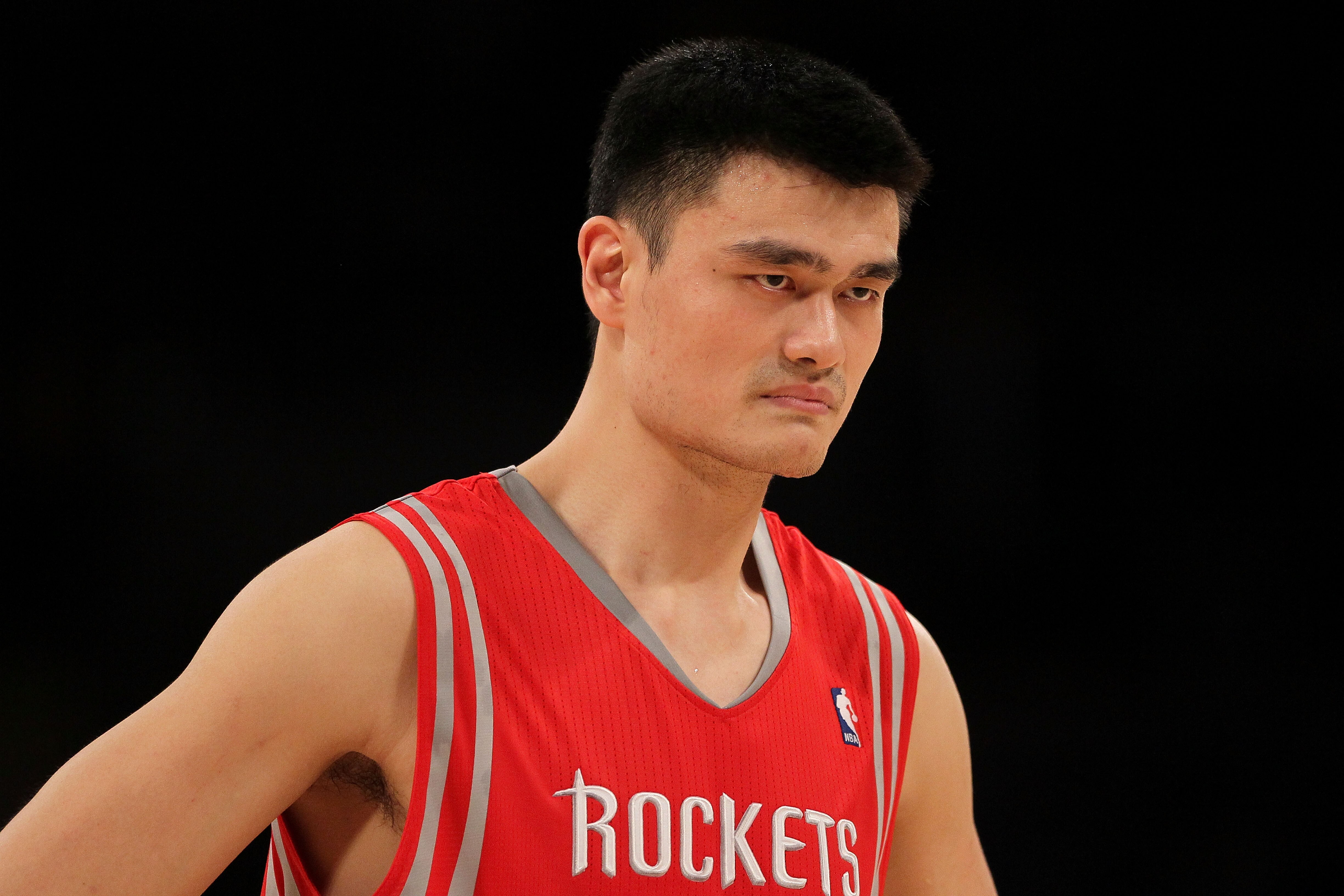 LOS ANGELES, CA - OCTOBER 26:  Yao Ming #11 of the Houston Rockets looks on during their opening night game against the Los Angeles Lakers at Staples Center on October 26, 2010 in Los Angeles, California. NOTE TO USER: User expressly acknowledges and agre