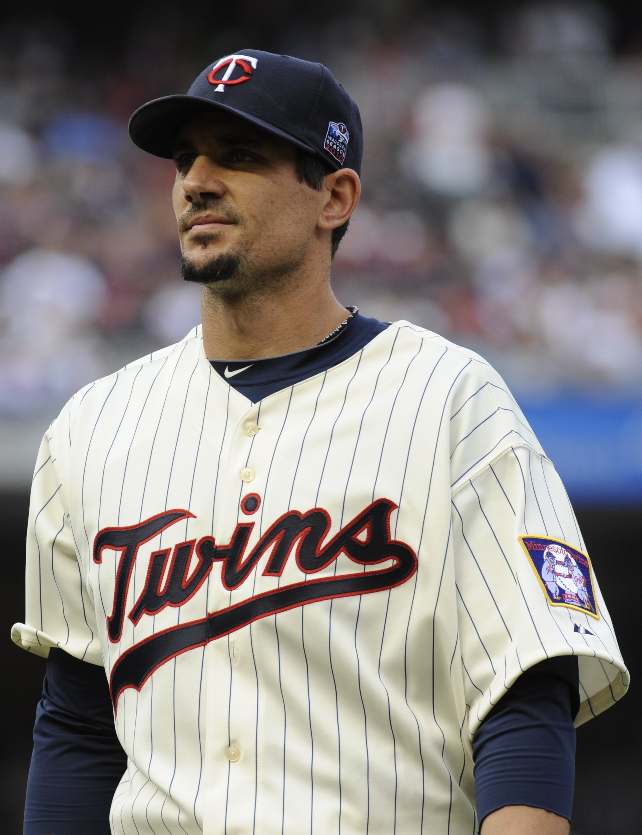 MINNEAPOLIS, MN - APRIL 12: Carl Pavano #48 of the Minnesota Twins returns the dugout in the middle of the fifth inning against the Boston Red Sox during the Twins home opener at Target Field on April 12, 2010 in Minneapolis, Minnesota. (Photo by Hannah F MINNEAPOLIS, MN - APRIL 12: Carl Pavano #48 of the Minnesota Twins returns the dugout in the middle of the fifth inning against the Boston Red Sox during the Twins home opener at Target Field on April 12, 2010 in Minneapolis, Minnesota. (Photo by Hannah F