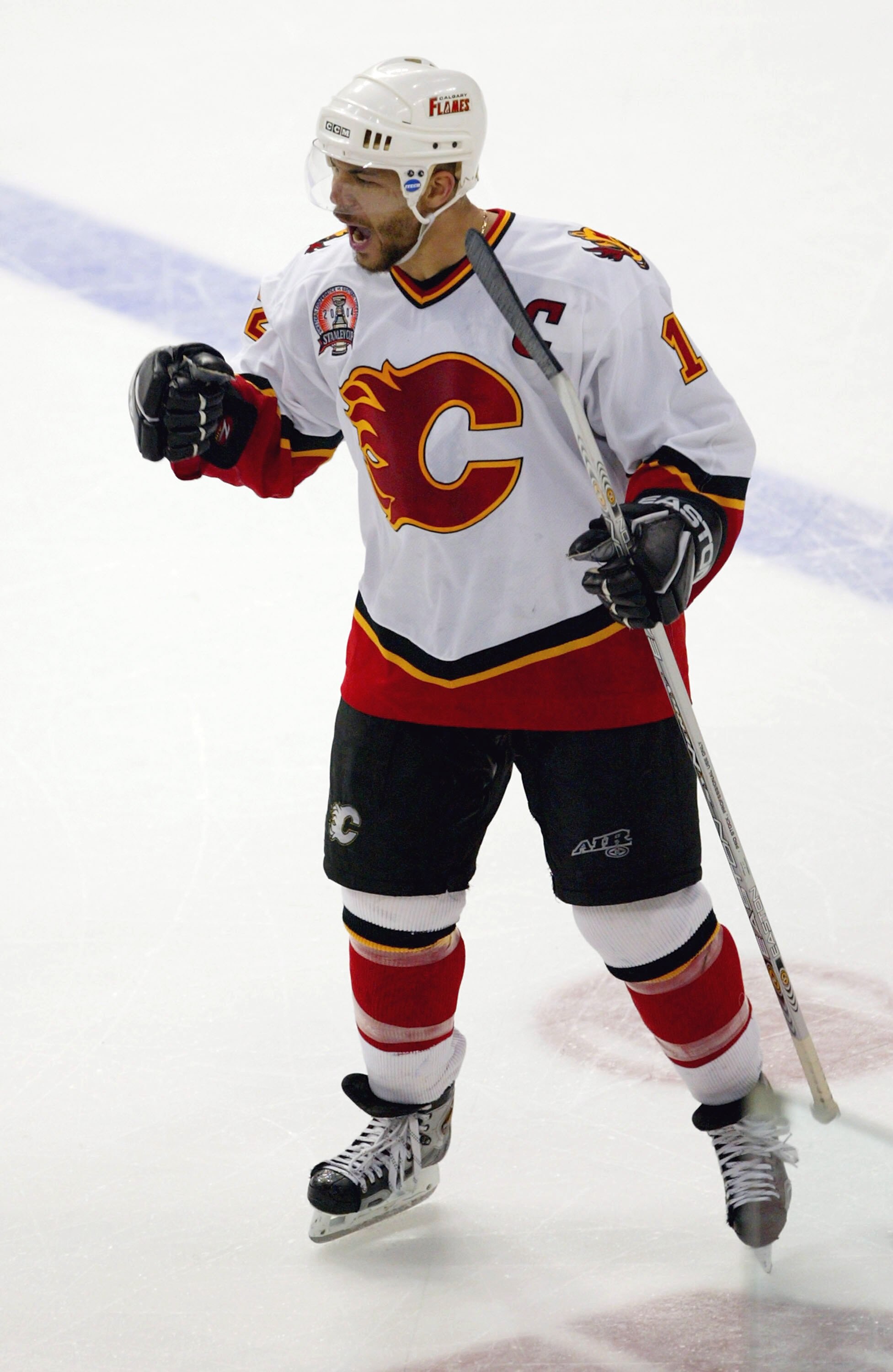 TAMPA, FL - JUNE 7:  Jarome Iginla #12 of the Calgary Flames celebrates a goal in the third period by teammate Craig Conroy #22 against the Tampa Bay Lightning in game seven of the NHL Stanley Cup Finals on June 7, 2004 at the St. Pete Times Forum in Tamp