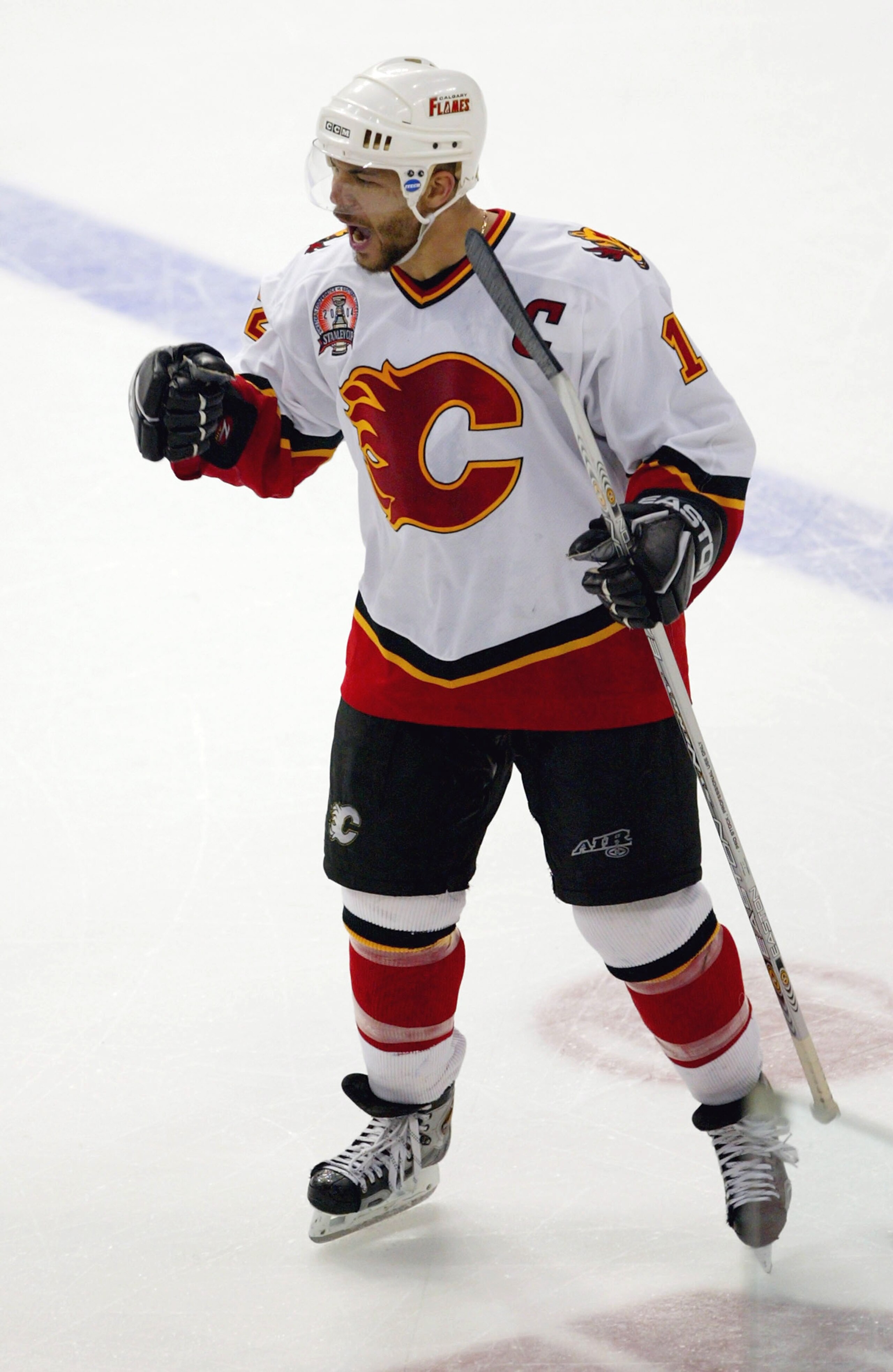 TAMPA, FL - JUNE 7:  Jarome Iginla #12 of the Calgary Flames celebrates a goal in the third period by teammate Craig Conroy #22 against the Tampa Bay Lightning in game seven of the NHL Stanley Cup Finals on June 7, 2004 at the St. Pete Times Forum in Tamp