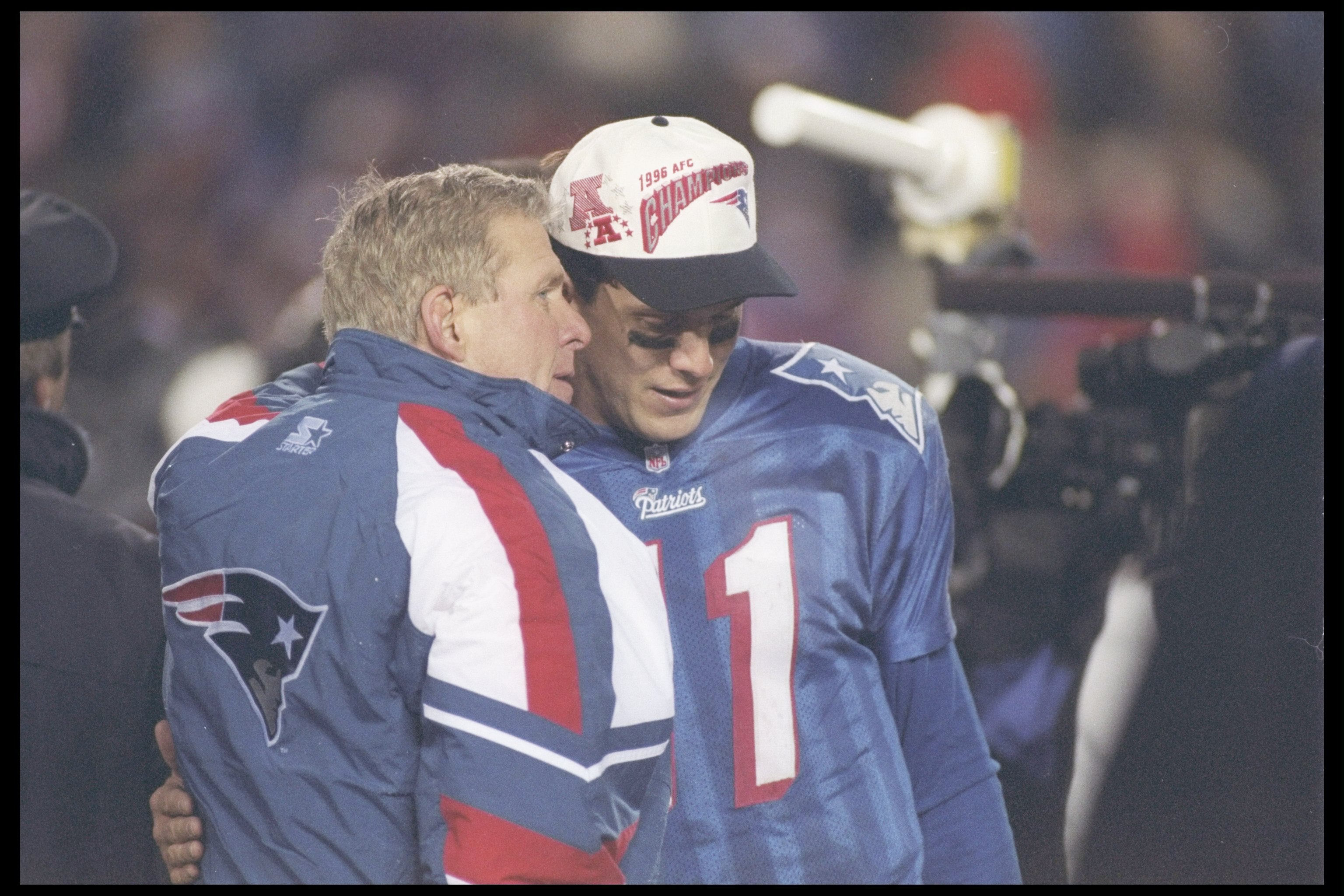 12 Jan 1997:  Head coach Bill Parcells of the New England Patriots confides in his quarterback Drew Bledsoe #11 during the  AFC Championship game against the Jacksonville Jaguars played at the Foxboro Stadium in Foxboro, Massachusetts. The Patriots won,