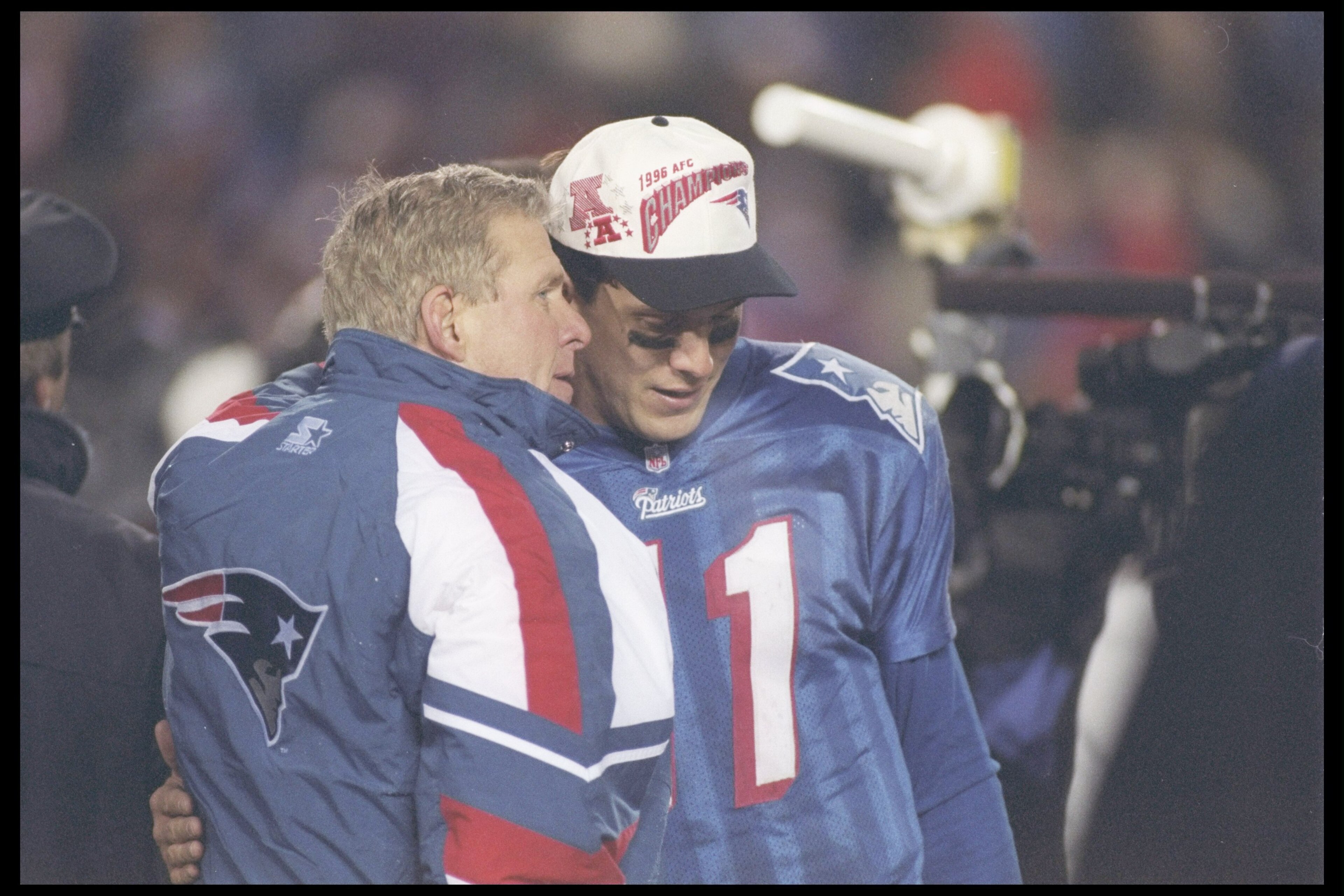 12 Jan 1997:  Head coach Bill Parcells of the New England Patriots confides in his quarterback Drew Bledsoe #11 during the  AFC Championship game against the Jacksonville Jaguars played at the Foxboro Stadium in Foxboro, Massachusetts. The Patriots won,