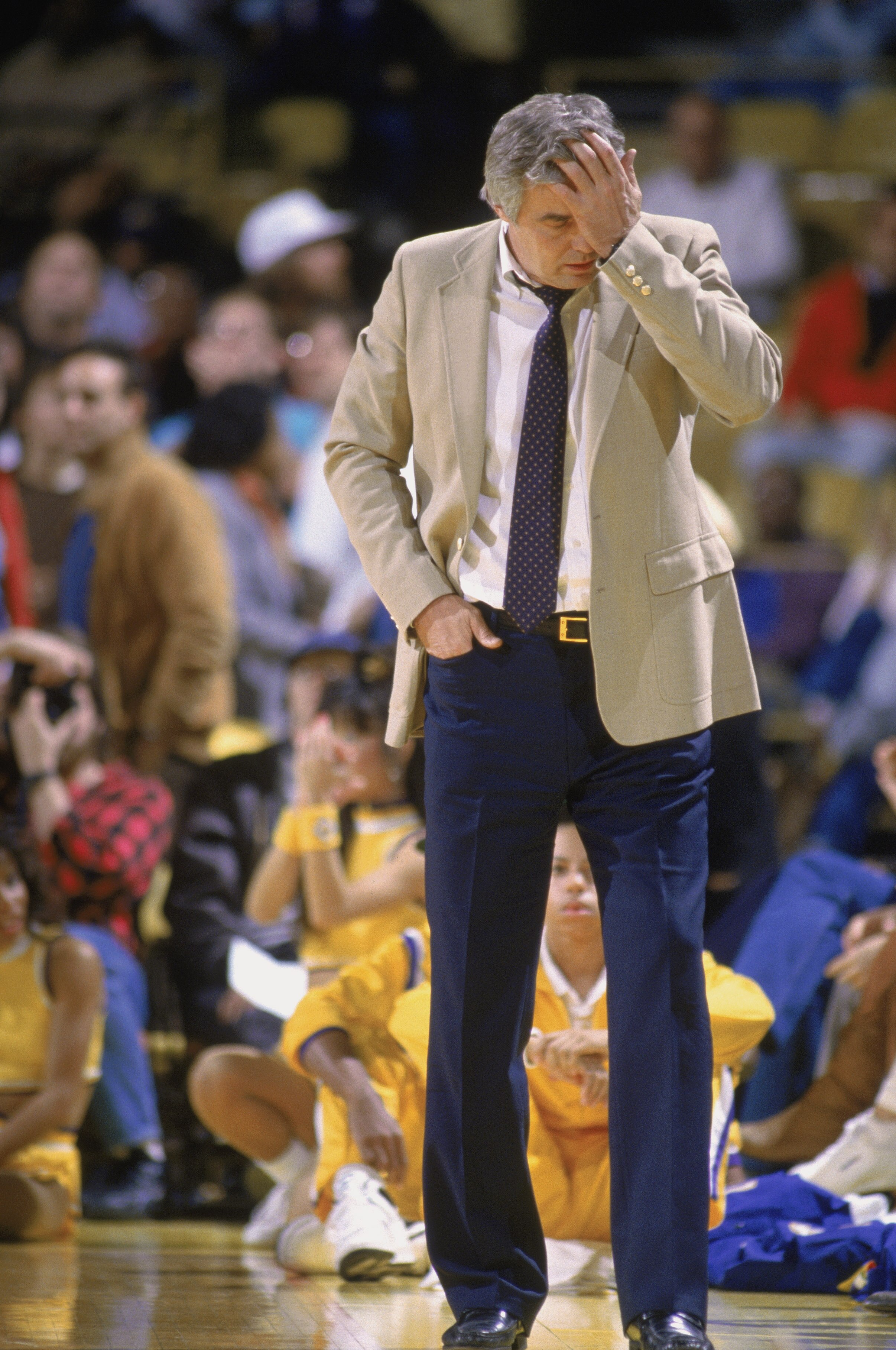 LOS ANGELES - 1988:  Head coach Doug Moe of the Denver Nuggets rubs his head during the NBA game against the Los Angeles Lakers at the Great Western Forum in Los Angeles, California in 1988. NOTE TO USER: User expressly acknowledges and agrees that, by do