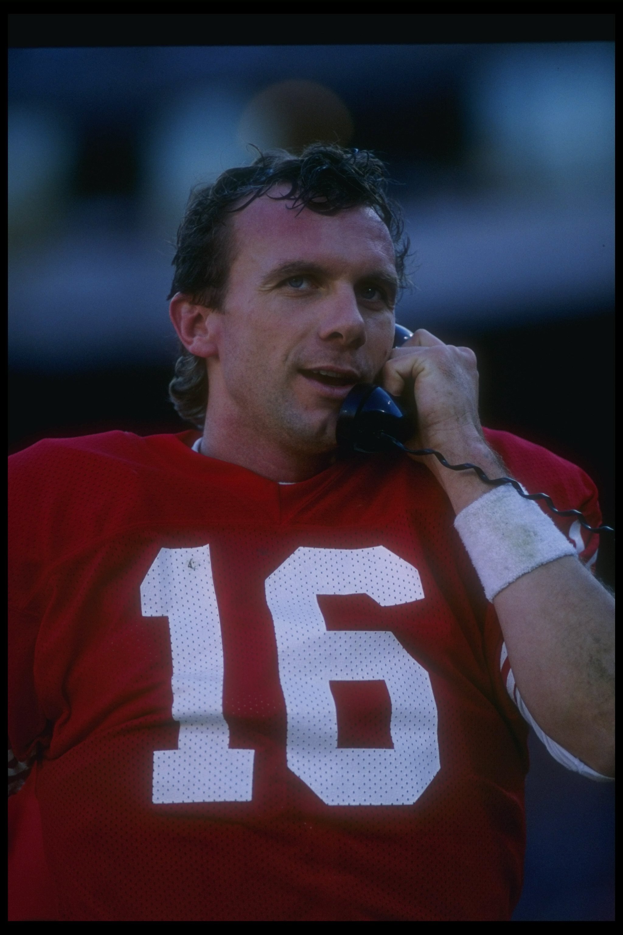 1 Jan 1989:  Quarterback Joe Montana of the San Francisco 49ers talks on the phone during a game against the Minnesota Vikings at Candlestick Park in San Francisco, California.  The 49ers won the game, 34-9. Mandatory Credit: Otto Greule  /Allsport