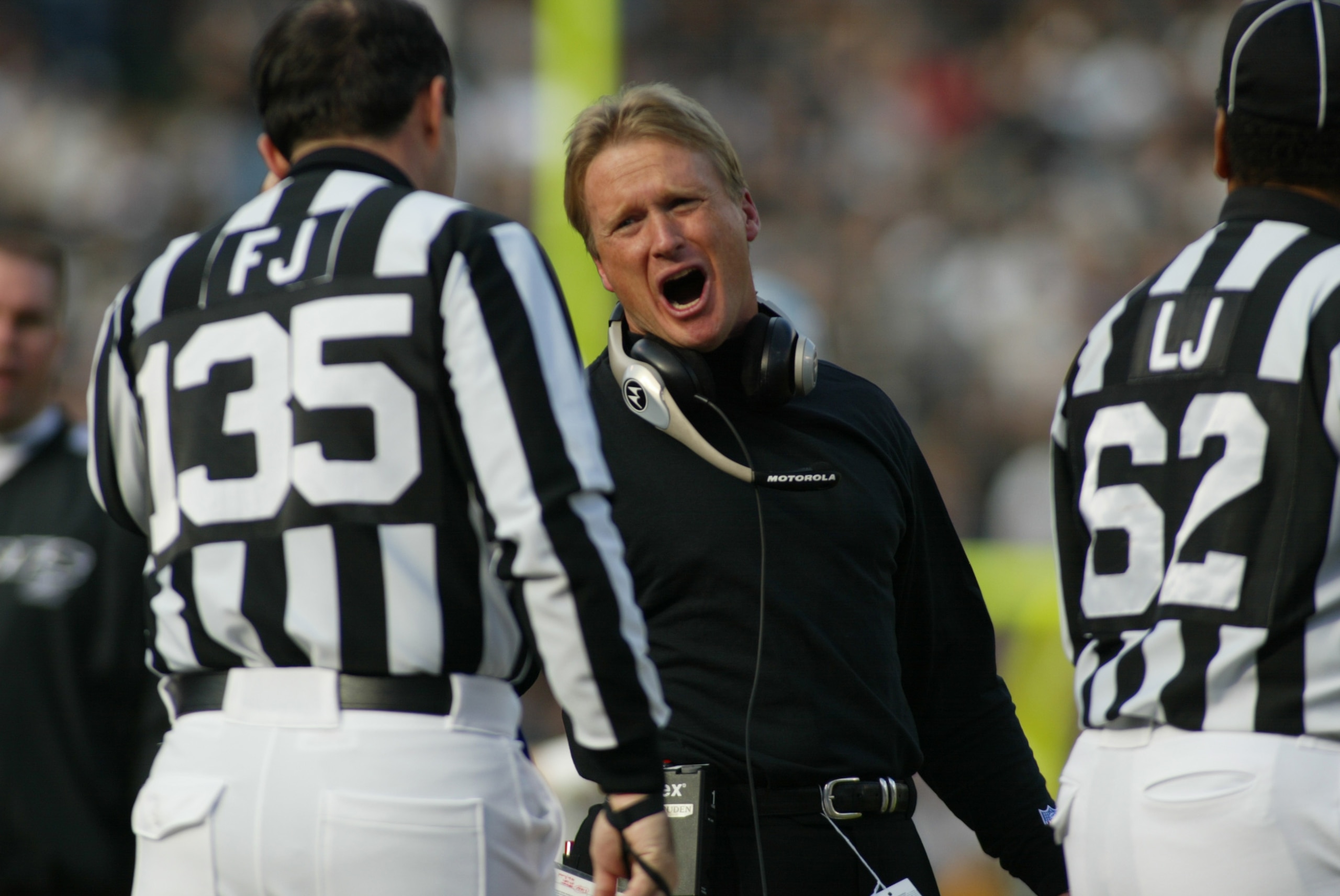 6 Jan 2002:  Head coach Jon Gruden of the Oakland Raiders talks to an official during the game against the New York Jets at Network Associates Coliseum in Oakland, California. The Jets won 24-22. DIGITAL IMAGE. Mandatory  Credit : Jed Jacobsohn/Getty Imag