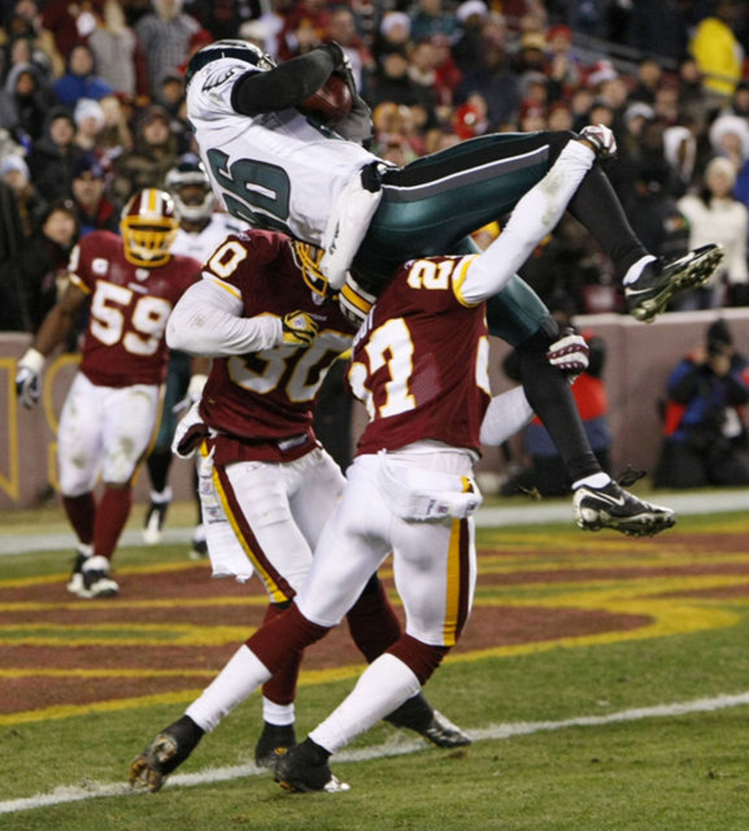 Check out how high Reggie Brown was thrown in the air by the Redskins' defenders on the game's final play. And look how close he was to scoring.