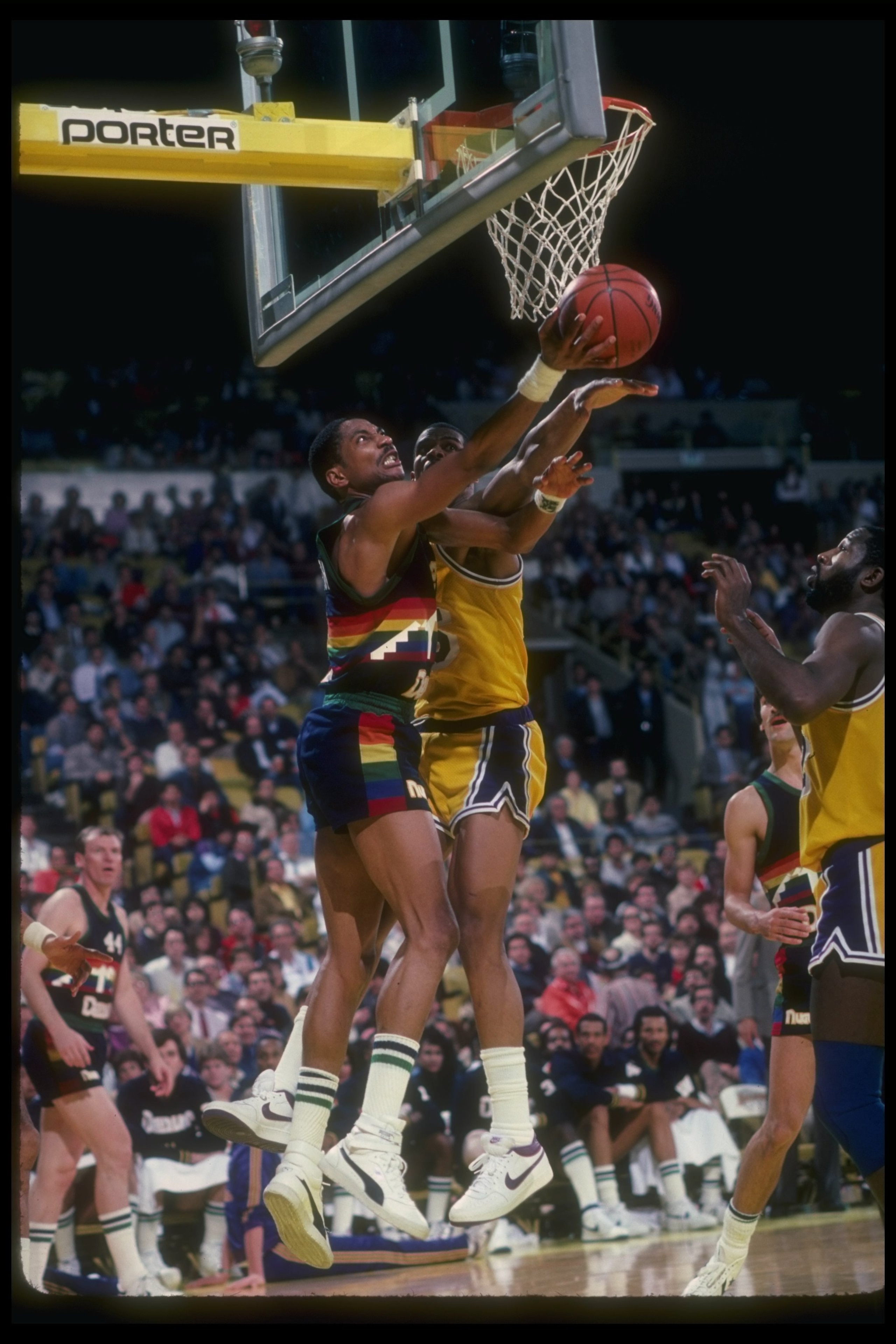 1980''s:  Guard Alex English of the Denver Nuggets goes up for the ball during a game versus the Los Angeles Lakers at the Forum in Inglewood, California. Mandatory Credit: Stephen Dunn  /Allsport Mandatory Credit: Stephen Dunn  /Allsport