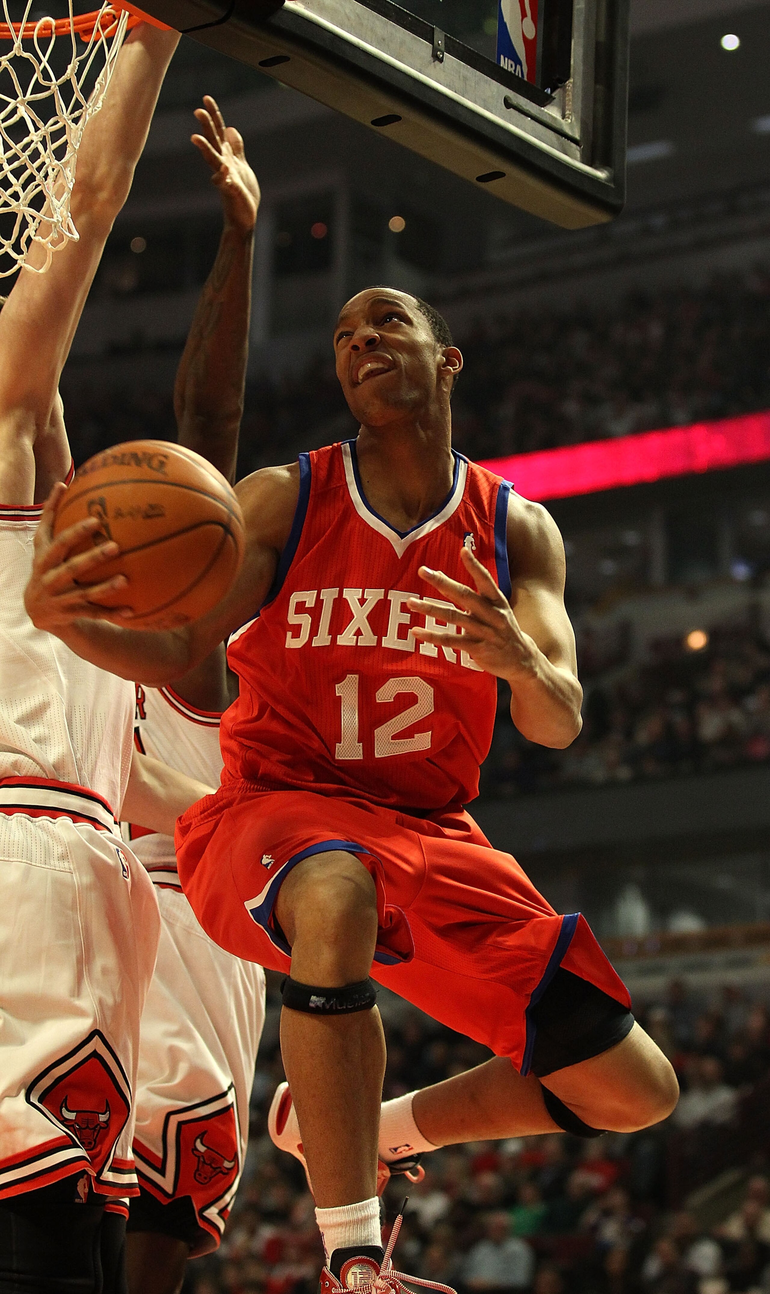CHICAGO, IL - DECEMBER 21: Evan Turner #12 of the Philadelphia 76ers puts up a shot against the Chicago Bulls at the United Center on December 21, 2010 in Chicago, Illinois. NOTE TO USER: User expressly acknowledges and agrees that, by downloading and/or CHICAGO, IL - DECEMBER 21: Evan Turner #12 of the Philadelphia 76ers puts up a shot against the Chicago Bulls at the United Center on December 21, 2010 in Chicago, Illinois. NOTE TO USER: User expressly acknowledges and agrees that, by downloading and/or