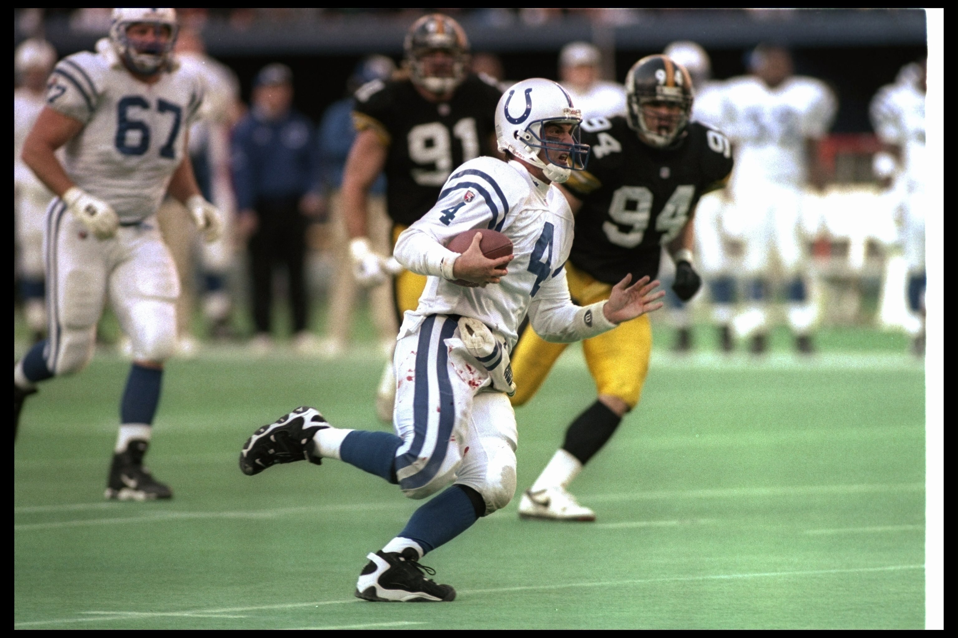 14 Jan 1996:  Quarterback Jim Harbaugh of the Indianapolis Colts moves the ball during a playoff game against the Pittsburgh Steelers at Three Rivers Stadium in Pittsburgh, Pennsylvania.  The Steelers won the game, 20-16. Mandatory Credit: Rick Stewart  /
