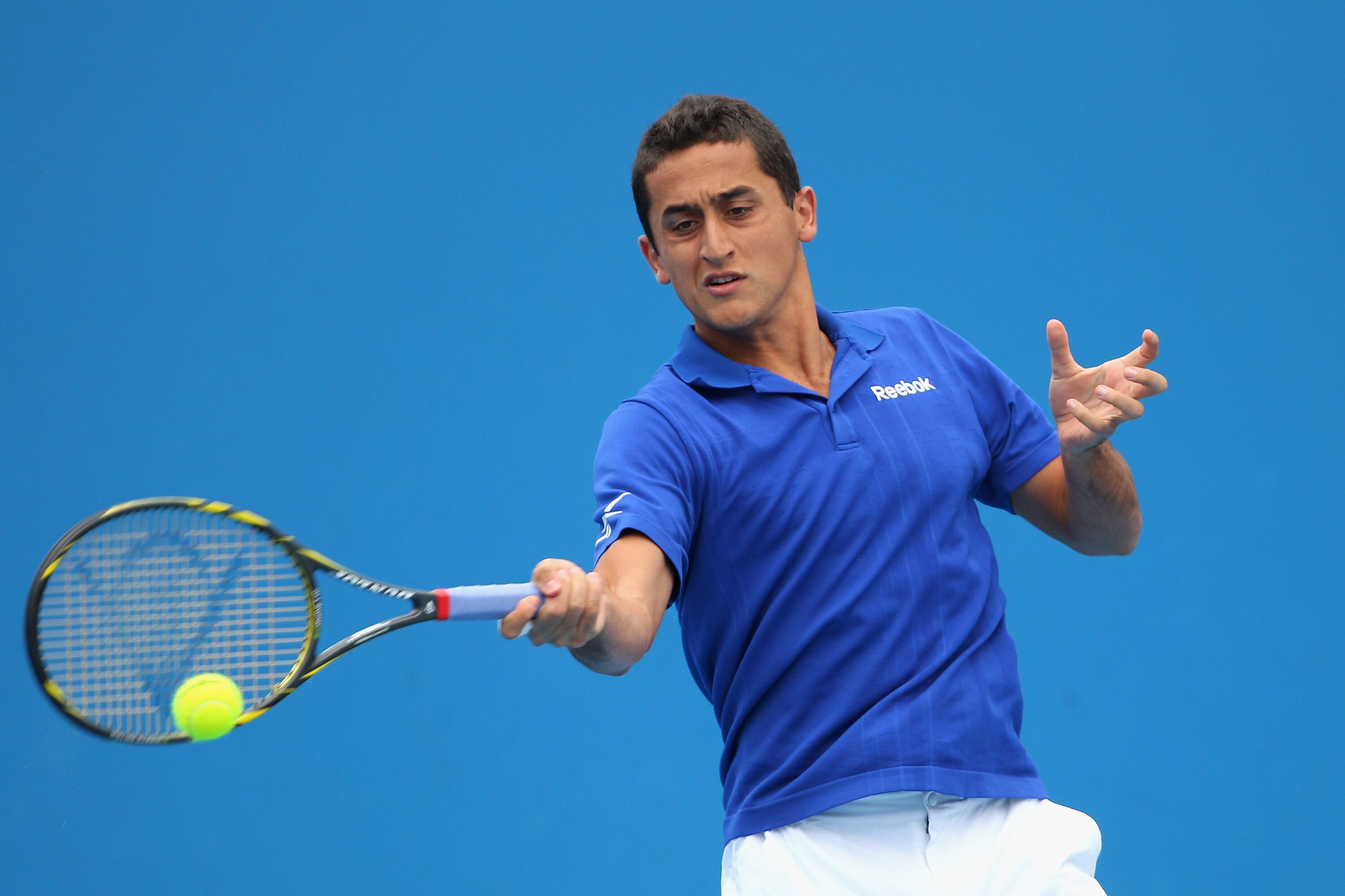 MELBOURNE, AUSTRALIA - JANUARY 17:  Nicolas Almagro of Spain plays a forehand in his/her first round match against Stephane Robert of France during day one of the 2011 Australian Open at Melbourne Park on January 17, 2011 in Melbourne, Australia.  (Photo