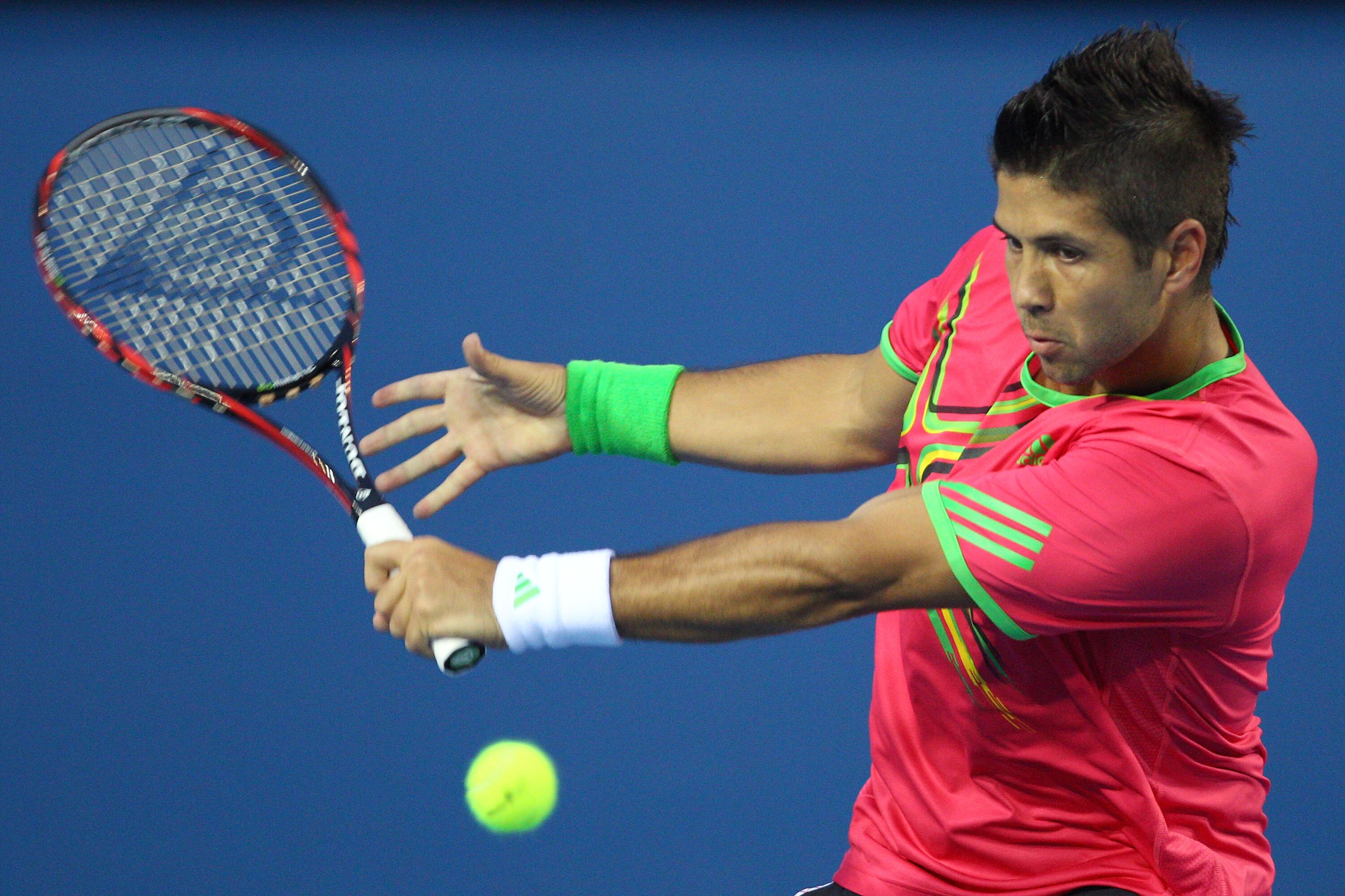 MELBOURNE, AUSTRALIA - JANUARY 17:  Fernando Verdasco of Spain plays a backhand in his first round match against Rainer Schuettler of Germany during day one of the 2011 Australian Open at Melbourne Park on January 17, 2011 in Melbourne, Australia.  (Photo