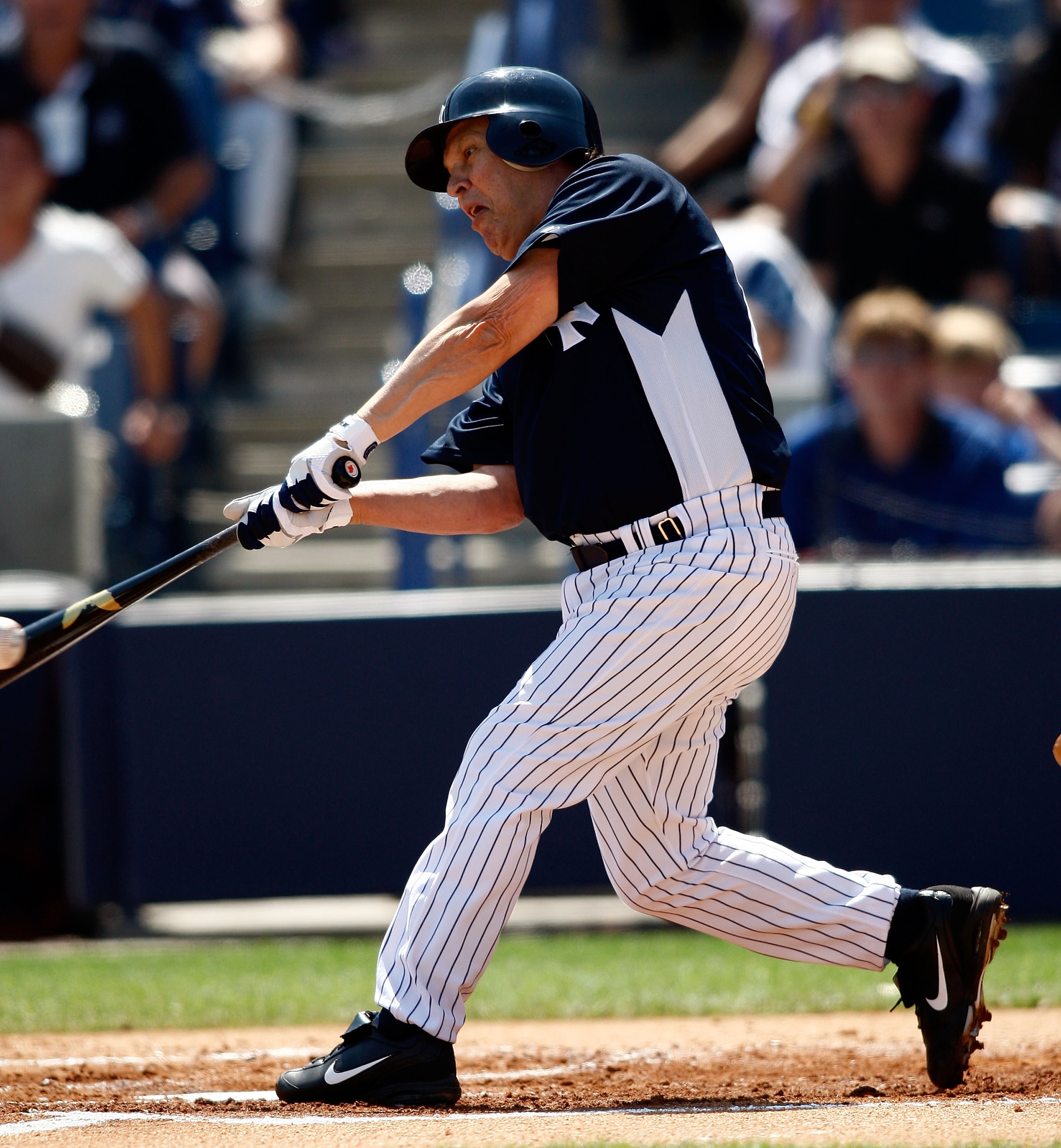 TAMPA, FL - MARCH 13: Billy Crystal #60 of the New York Yankees fouls off a pitch against the Pittsburgh Pirates during the Grapefruit League Spring Training game on March 13, 2008 at Legends Field in Tampa, Florida. (Photo by J. Meric/Getty Images)