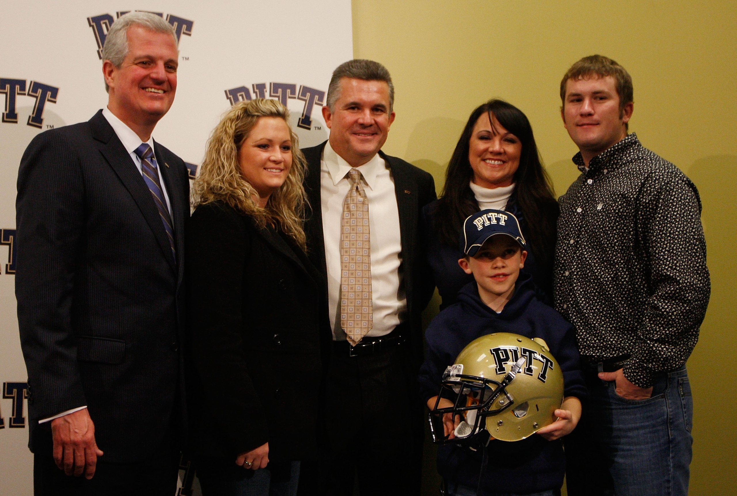 PITTSBURGH - JANUARY 11: The new University of Pittsburgh head football coach, Todd Graham (center), poses for a photograph with members of his family and University of Pittsburgh athletic director, Steve Pederson (far left), during a press conference on PITTSBURGH - JANUARY 11: The new University of Pittsburgh head football coach, Todd Graham (center), poses for a photograph with members of his family and University of Pittsburgh athletic director, Steve Pederson (far left), during a press conference on