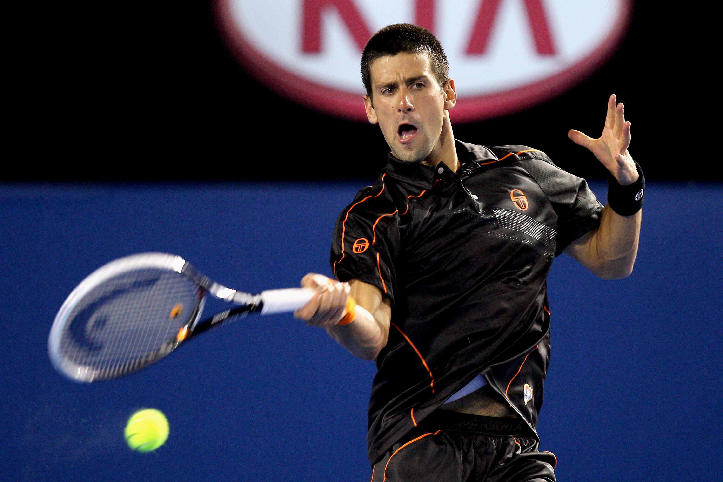 MELBOURNE, AUSTRALIA - JANUARY 17:  Novak Djkovic of Serbia plays a forehand in his first round match against Marcel Granollers of Spain during day one of the 2011 Australian Open at Melbourne Park on January 17, 2011 in Melbourne, Australia.  (Photo by C