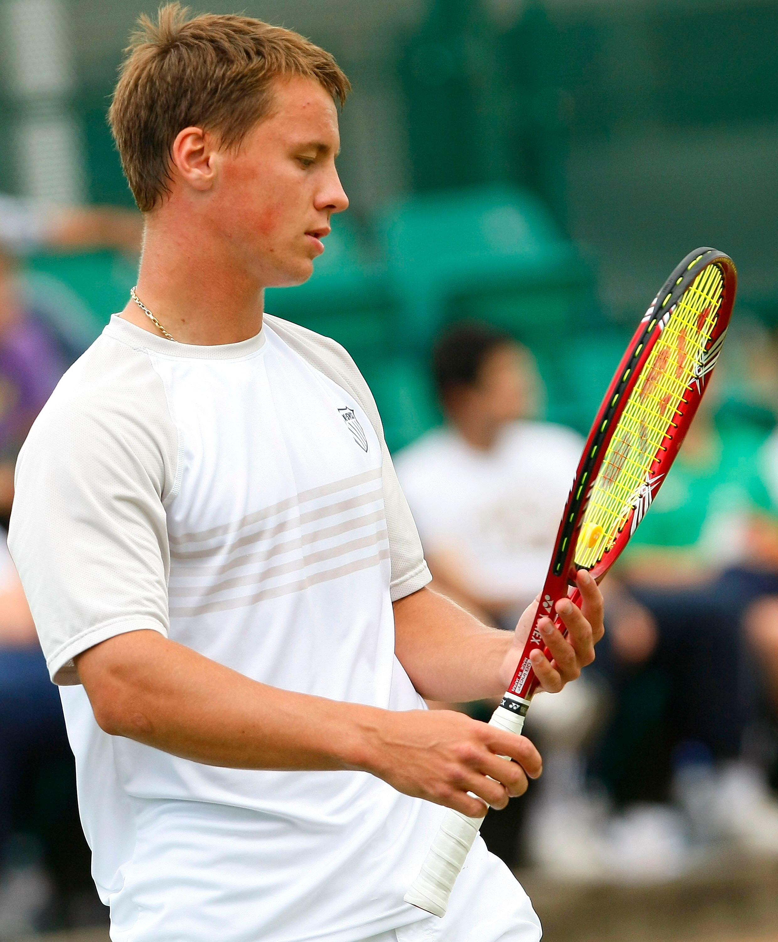 NOTTINGHAM, ENGLAND - JUNE 06: Ricardas Berankis of Lithuania looks at the raquete during the men's singles final match between Ricardas Berankis of Lithuania and Go Soeda of Japan on day 7 of the Aegon Trophy Nottingham at the Nottingham Tennis Centre on