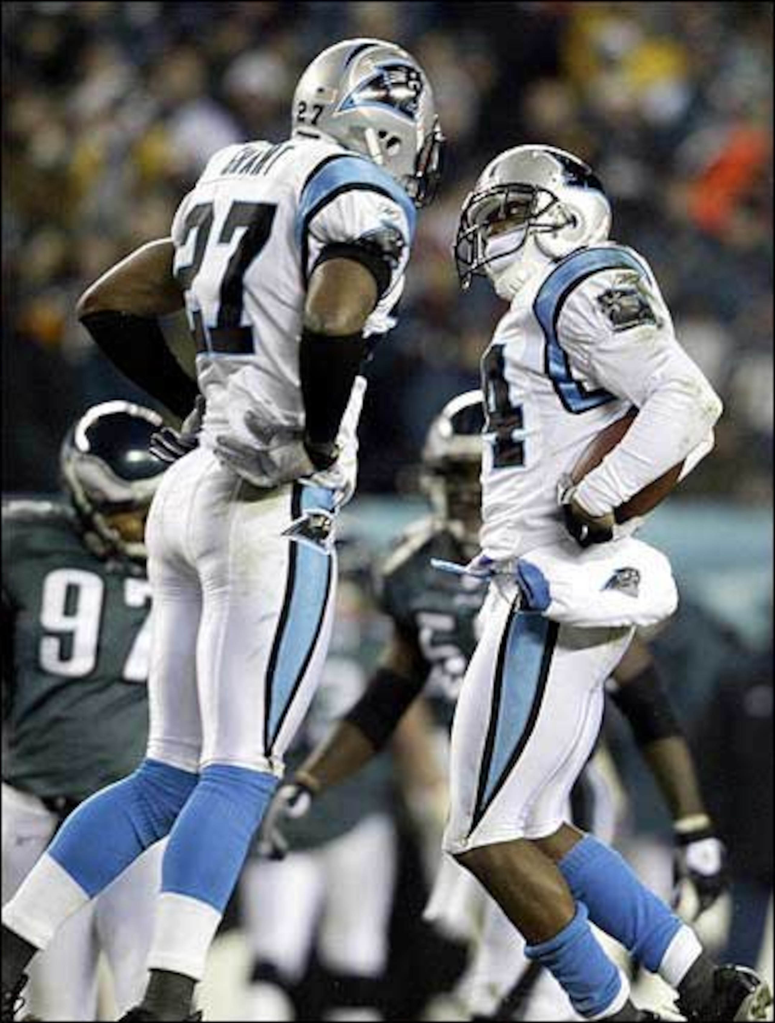 Who would have thought that the guy on the right - Ricky Manning - would pick off THREE passes from Donovan McNabb in the game?