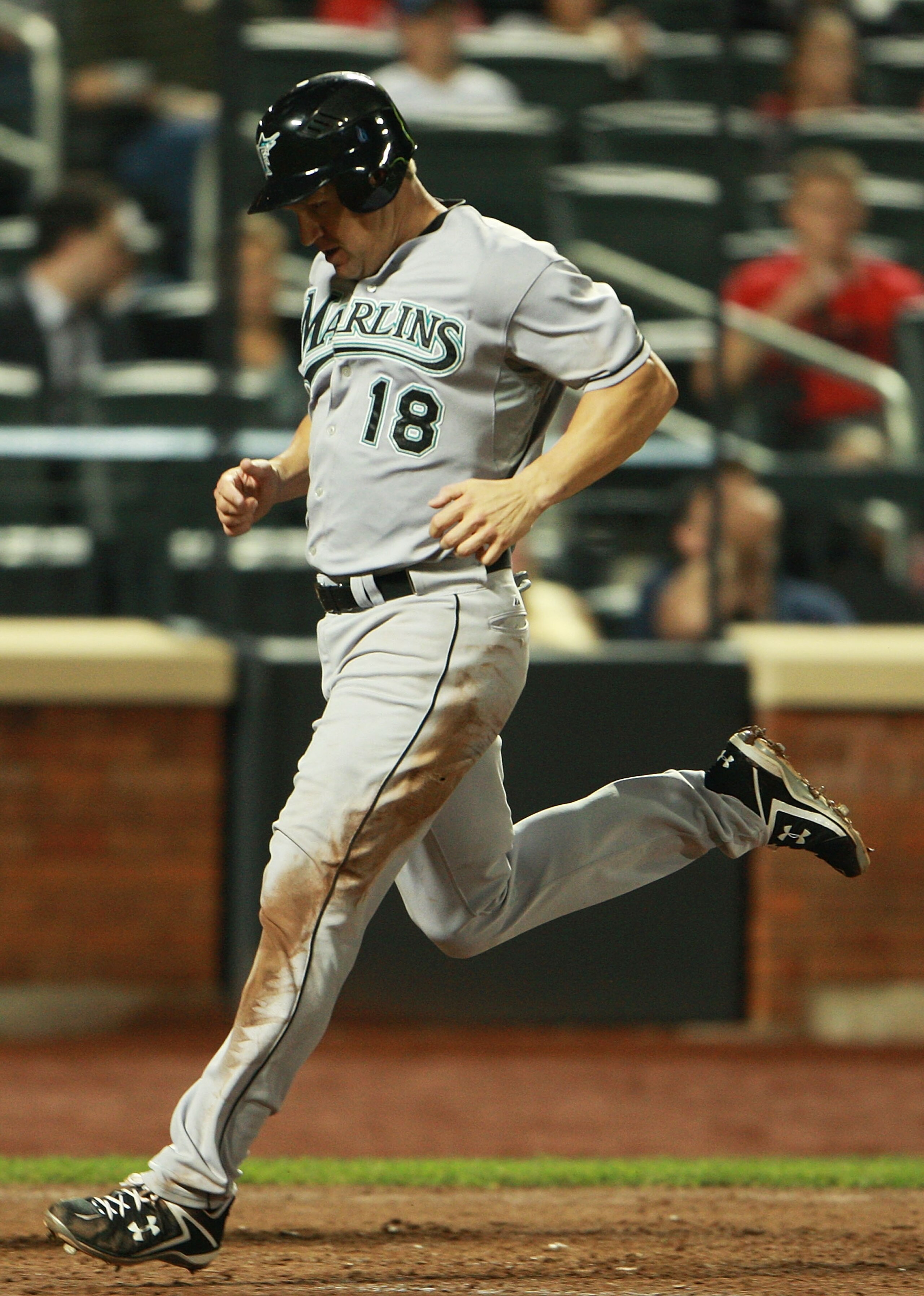NEW YORK - AUGUST 25: Wes Helms #18 of the Florida Marlins scores a run off of a double hit by Brett Hayes #9 (not shown) in the sixth inning against the New York Mets on August 25, 2010 at Citi Field in the Flushing neighborhood of the Queens borough of NEW YORK - AUGUST 25: Wes Helms #18 of the Florida Marlins scores a run off of a double hit by Brett Hayes #9 (not shown) in the sixth inning against the New York Mets on August 25, 2010 at Citi Field in the Flushing neighborhood of the Queens borough of