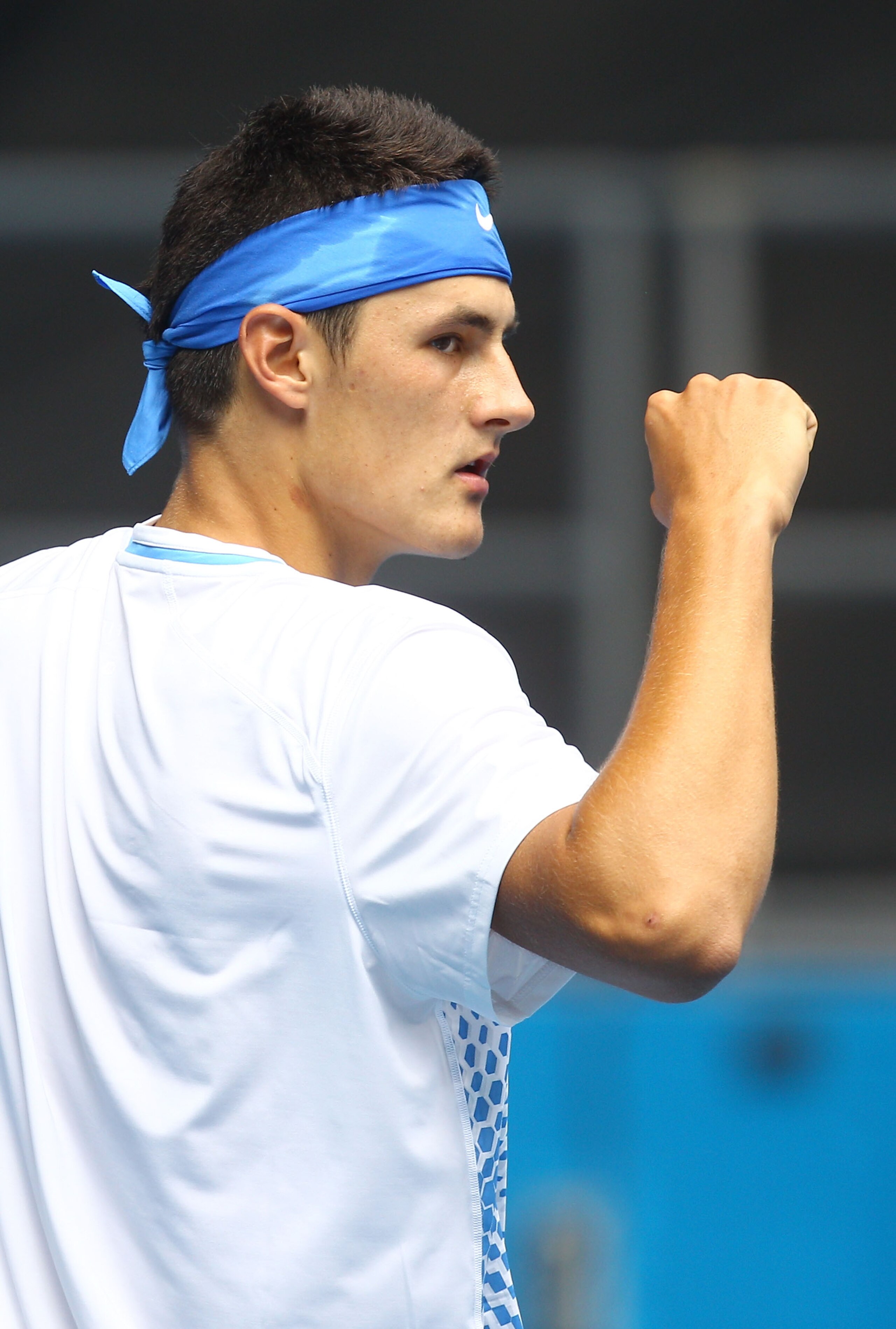 MELBOURNE, AUSTRALIA - JANUARY 18:  Bernard Tomic of Australia celebrates winning a point in his first round match against Jeremy Chardy of France during day two of the 2011 Australian Open at Melbourne Park on January 18, 2011 in Melbourne, Australia.  (