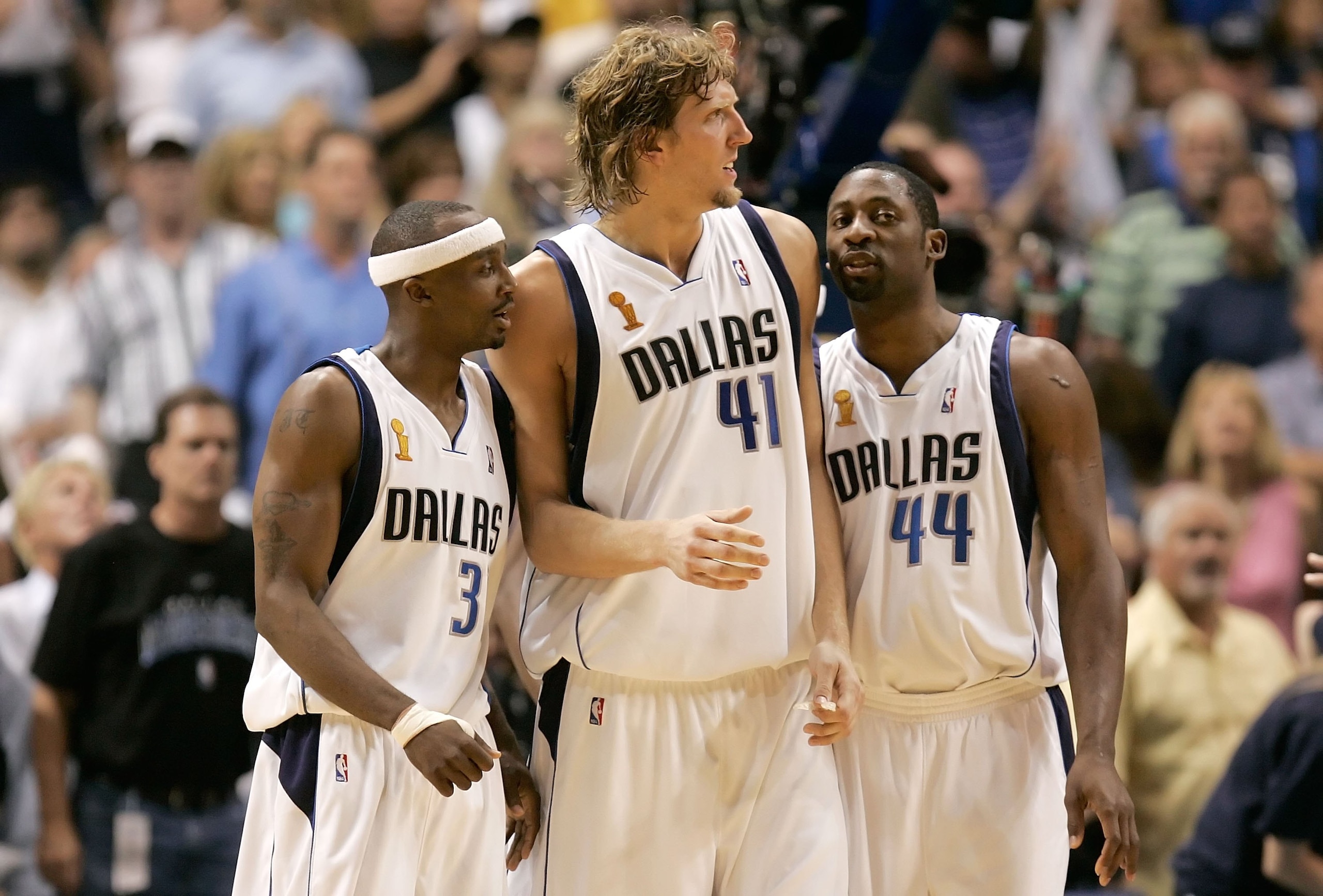 DALLAS - JUNE 11:  (L-R) Jason Terry #31, Dirk Nowitzki #41 and Adrian Griffin #44 of the Dallas Mavericks huddle together during the second quarter against the Miami Heat in game two of the 2006 NBA Finals on June 11, 2006 at American Airlines Center in
