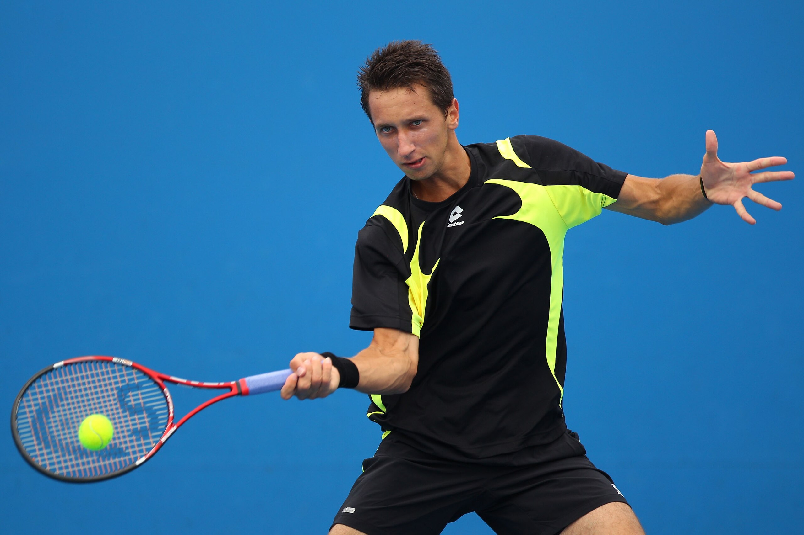 MELBOURNE, AUSTRALIA - JANUARY 17:  Sergiy Stakhovsky of the Ukraine plays a forehand in his first round match against Daniel Brands of Germany during day one of the 2011 Australian Open at Melbourne Park on January 17, 2011 in Melbourne, Australia.  (Pho