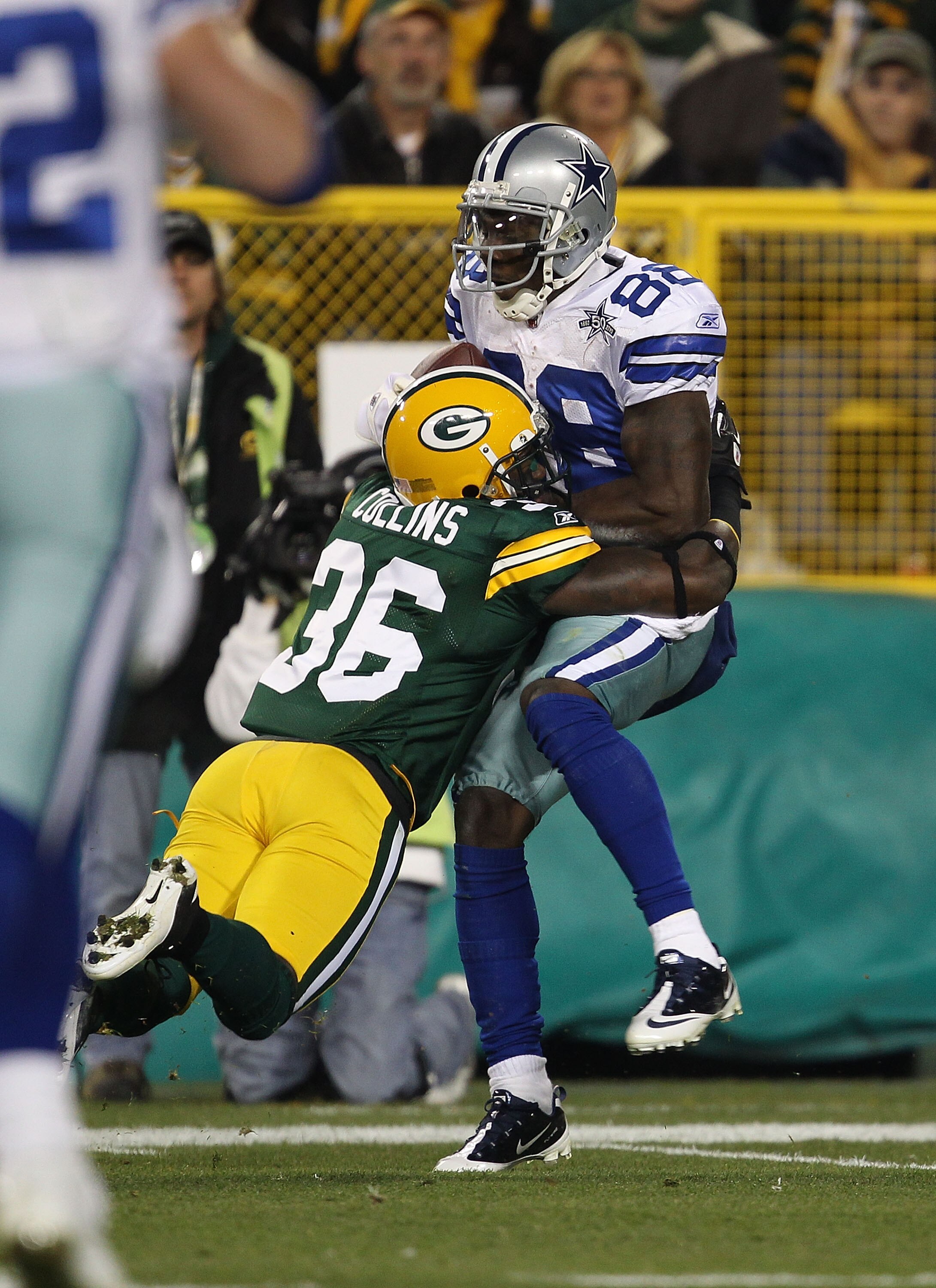 GREEN BAY, WI - NOVEMBER 07: Nick Collins #36 of the Green Bay Packers tackles Dez Bryant #88 of the Dallas Cowboys at Lambeau Field on November 7, 2010 in Green Bay, Wisconsin. The Packers defeated the Cowboys 45-7. (Photo by Jonathan Daniel/Getty Images