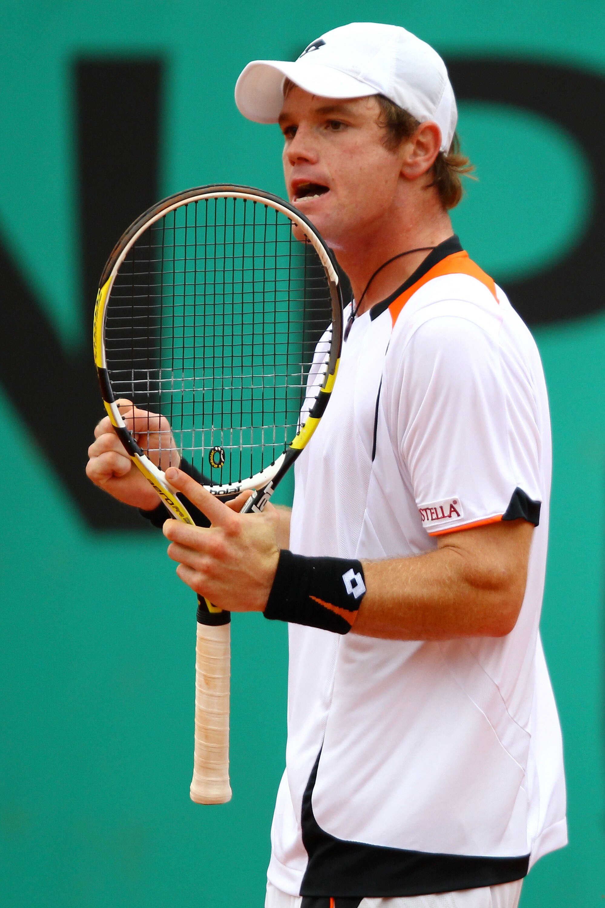 PARIS - MAY 27:  Blaz Kavcic of Slovenia celebrates a point during the men's singles second round match between Andy Roddick of the United States and Blaz Kavcic of Slovenia on day five of the French Open at Roland Garros on May 27, 2010 in Paris, France.