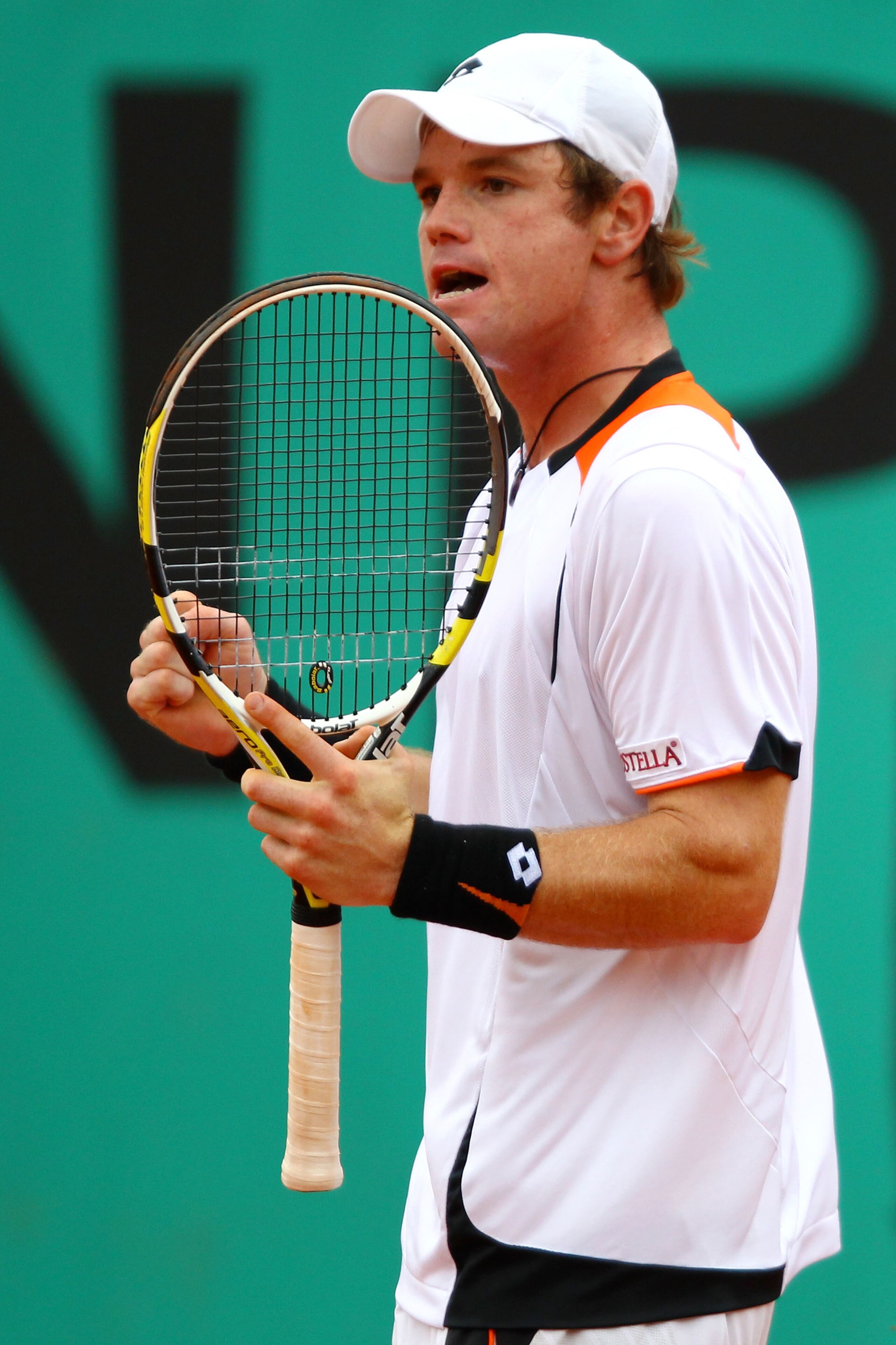 PARIS - MAY 27:  Blaz Kavcic of Slovenia celebrates a point during the men's singles second round match between Andy Roddick of the United States and Blaz Kavcic of Slovenia on day five of the French Open at Roland Garros on May 27, 2010 in Paris, France.