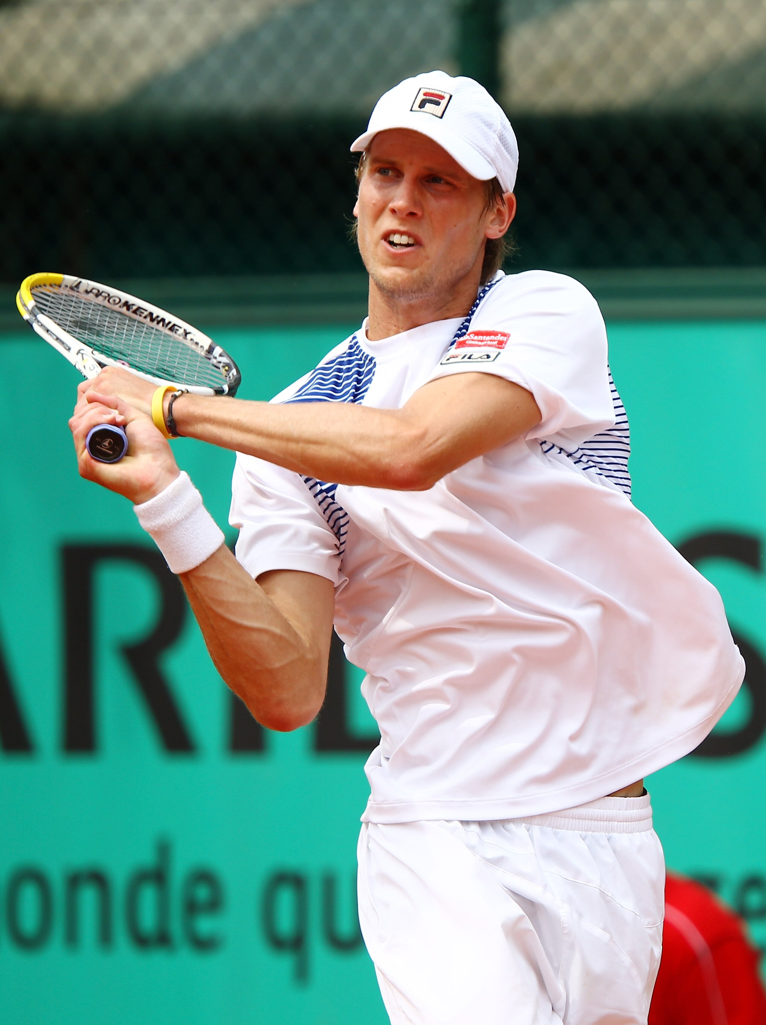 PARIS - MAY 25:  Andreas Seppi of Italy plays a backhand during the men's singles first round match between Santiago Ventura of Spain and Andreas Seppi of Italy on day three of the French Open at Roland Garros on May 25, 2010 in Paris, France.  (Photo by