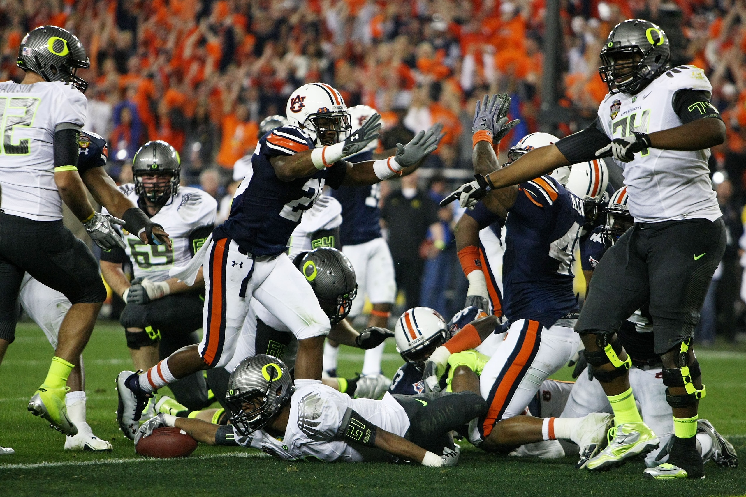 GLENDALE, AZ - JANUARY 10:  LaMichael James #21 of the Oregon Ducks can't get the ball out of the endzone and the Auburn Tigers score a safety in the second quarter of the Tostitos BCS National Championship Game at University of Phoenix Stadium on January