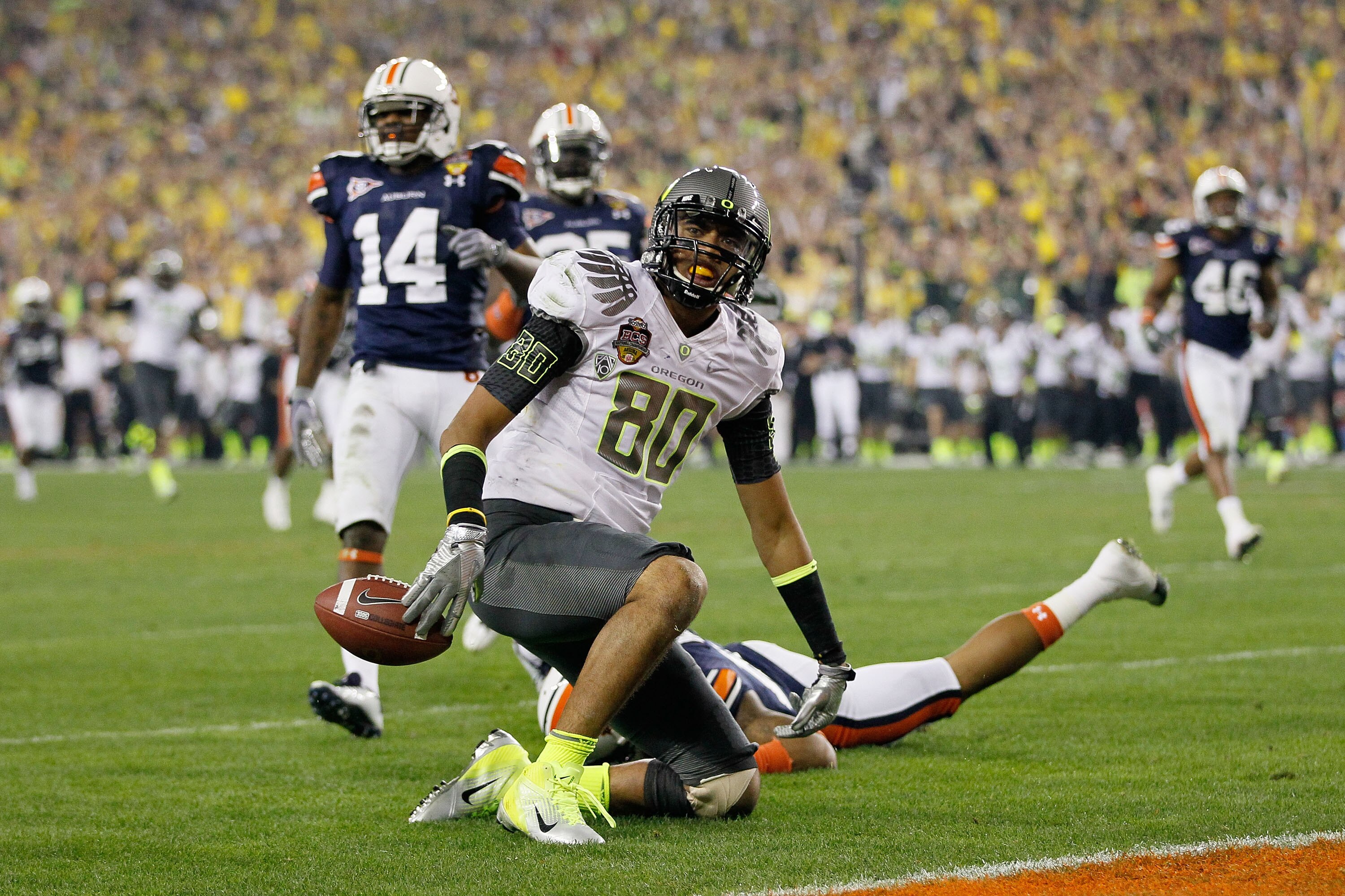 GLENDALE, AZ - JANUARY 10:  Lavasier Tuinei #80 of the Oregon Ducks reacts after a play against the Auburn Tigers during the Tostitos BCS National Championship Game at University of Phoenix Stadium on January 10, 2011 in Glendale, Arizona.  (Photo by Kevi