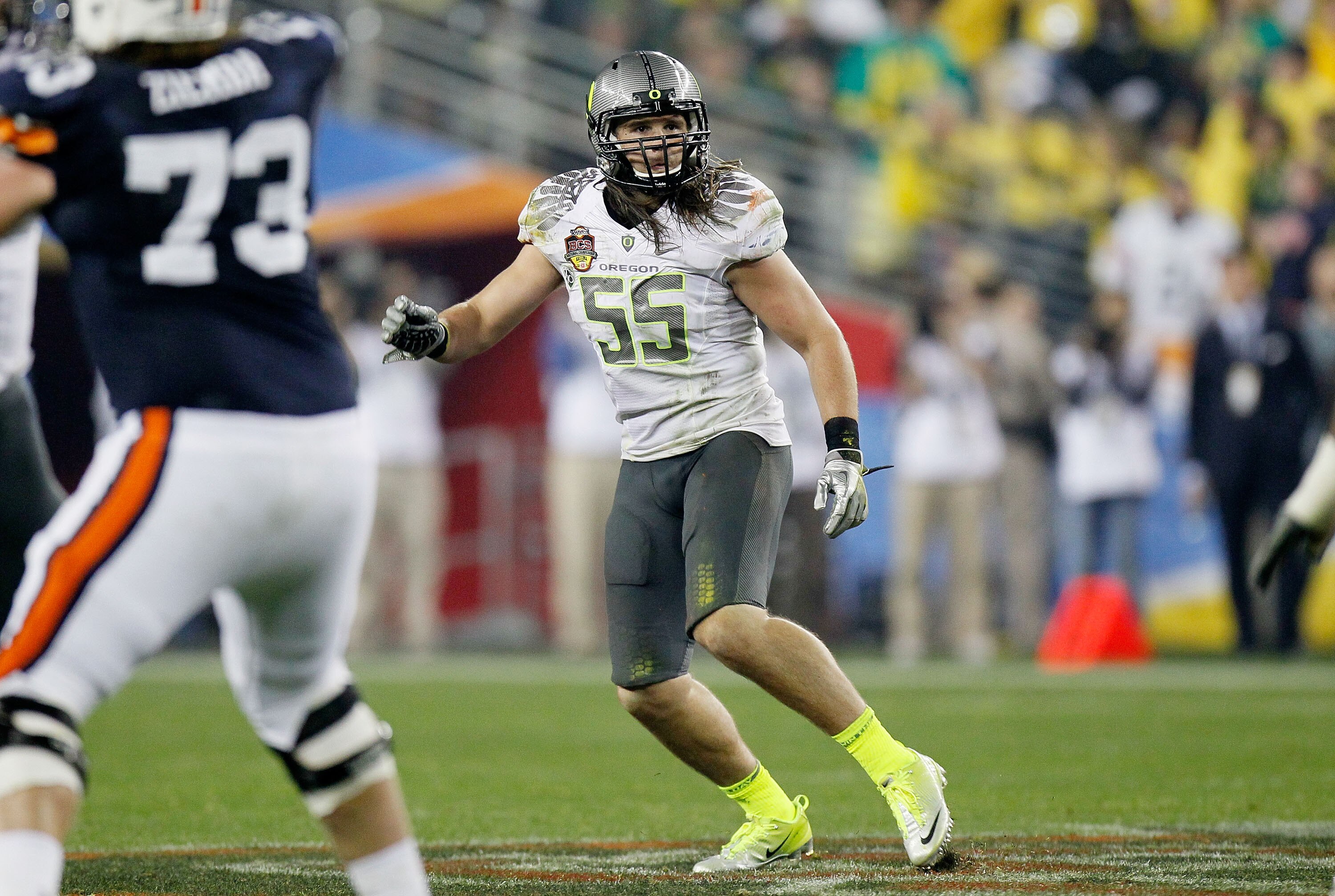 GLENDALE, AZ - JANUARY 10:  Casey Matthews #55 of the Oregon Ducks watches the play against the Auburn Tigers during the Tostitos BCS National Championship Game at University of Phoenix Stadium on January 10, 2011 in Glendale, Arizona.  (Photo by Kevin C.