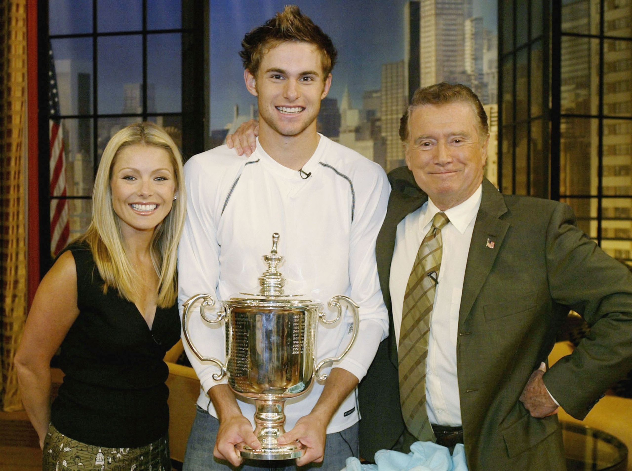 NEW YORK - SEPTEMBER 8:  US Open singles champion Andy Roddick meets Regis Philben and Kelli Rippa while making an appearance on the Regis & Kelli Show September 8, 2003 in New York City. (Photo by Matthew Stockman/Getty Images)