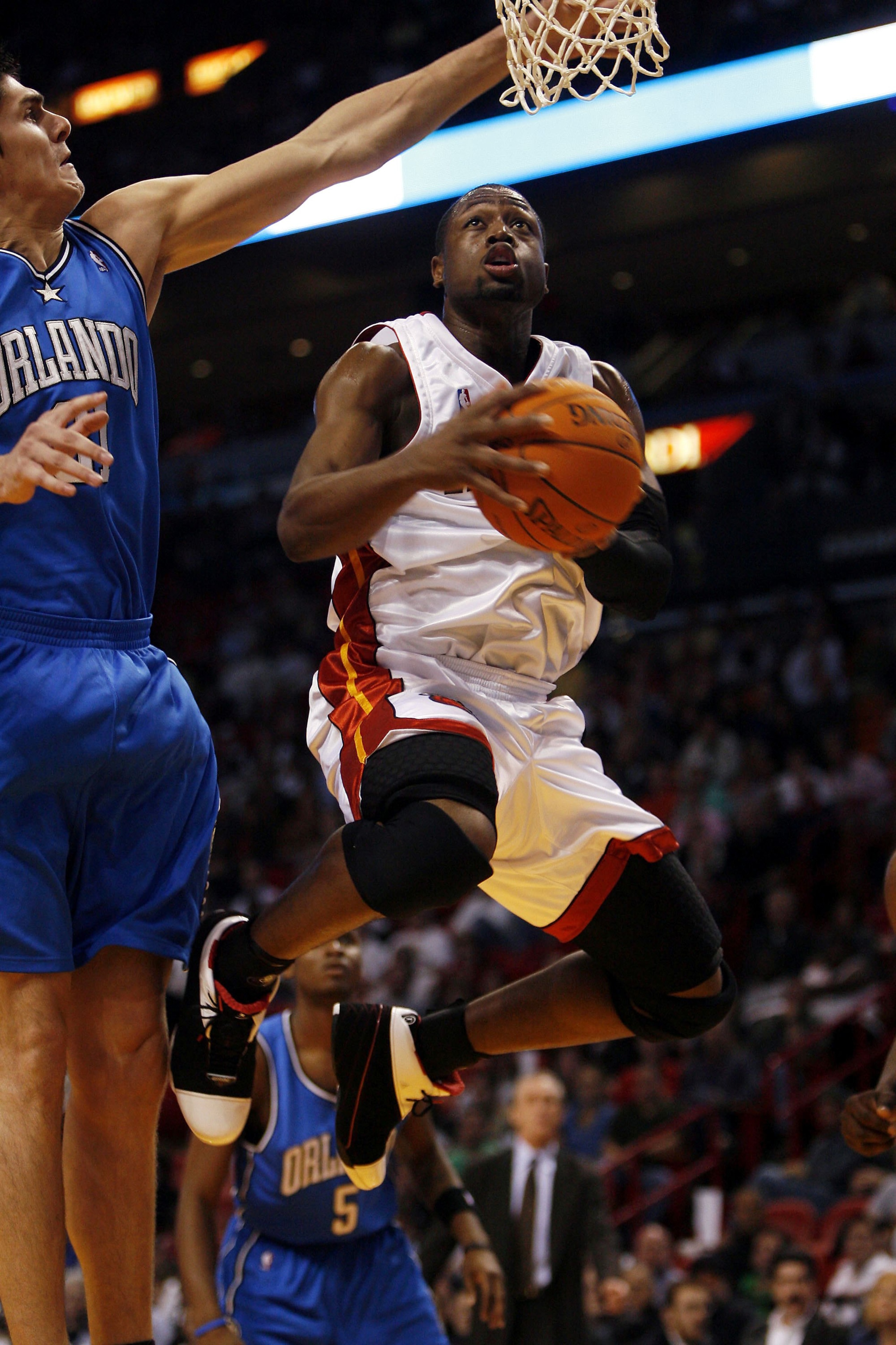 MIAMI - NOVEMBER 24: Forward Darko Milicic #31 of the Orlando Magic tries to block guard Dwyane Wade #3 of the Miami Heat in the first half on November 24, 2006 at the American Airlines Arena in Miami, Florida. NOTE TO USER: User expressly acknowledges a MIAMI - NOVEMBER 24: Forward Darko Milicic #31 of the Orlando Magic tries to block guard Dwyane Wade #3 of the Miami Heat in the first half on November 24, 2006 at the American Airlines Arena in Miami, Florida. NOTE TO USER: User expressly acknowledges a