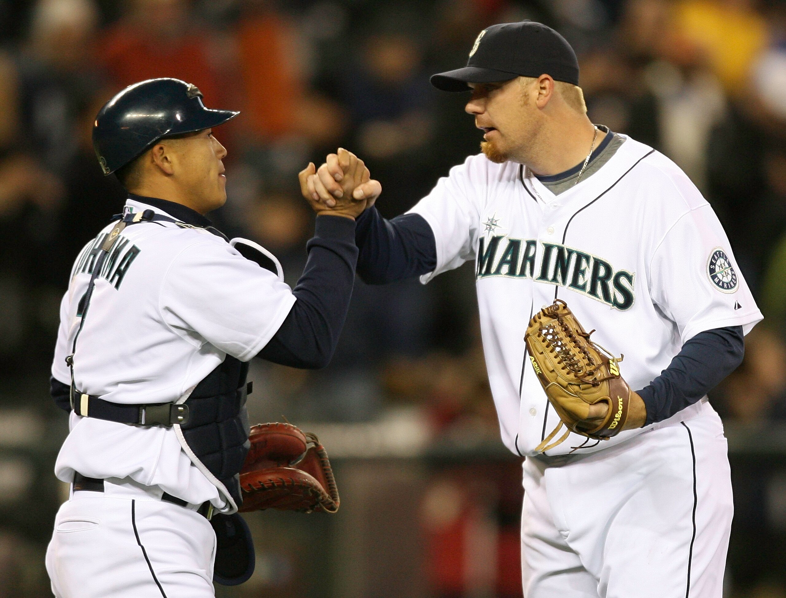 SEATTLE - MARCH 31:  Closing pitcher J.J. Putz #20 of the Seattle Mariners is congratulated by catcher Kenji Johjima #2 after defeating the Texas Rangers 5-2 in the Mariners' Home Opener on March 31, 2008 in Seattle, Washington. (Photo by Otto Greule Jr/G