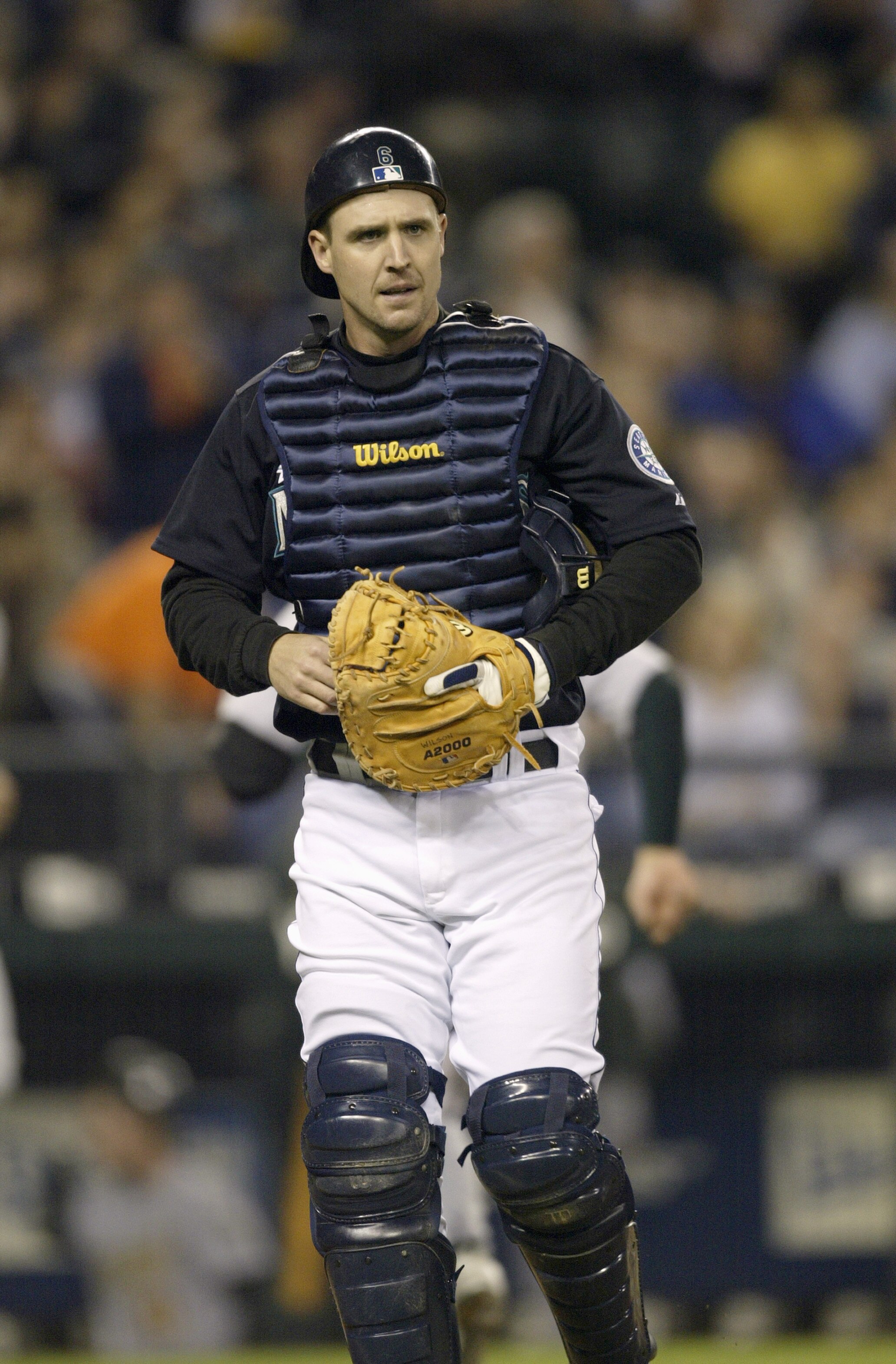 SEATTLE - SEPTEMBER 30:  Catcher Dan Wilson #6 of the Seattle Mariners walks on the field during a game against the Oakland Athletics on September 30 2005 at Safeco Field in Seattle Washington. The Mariners won 4-1. Wilson came back from knee surgery to m