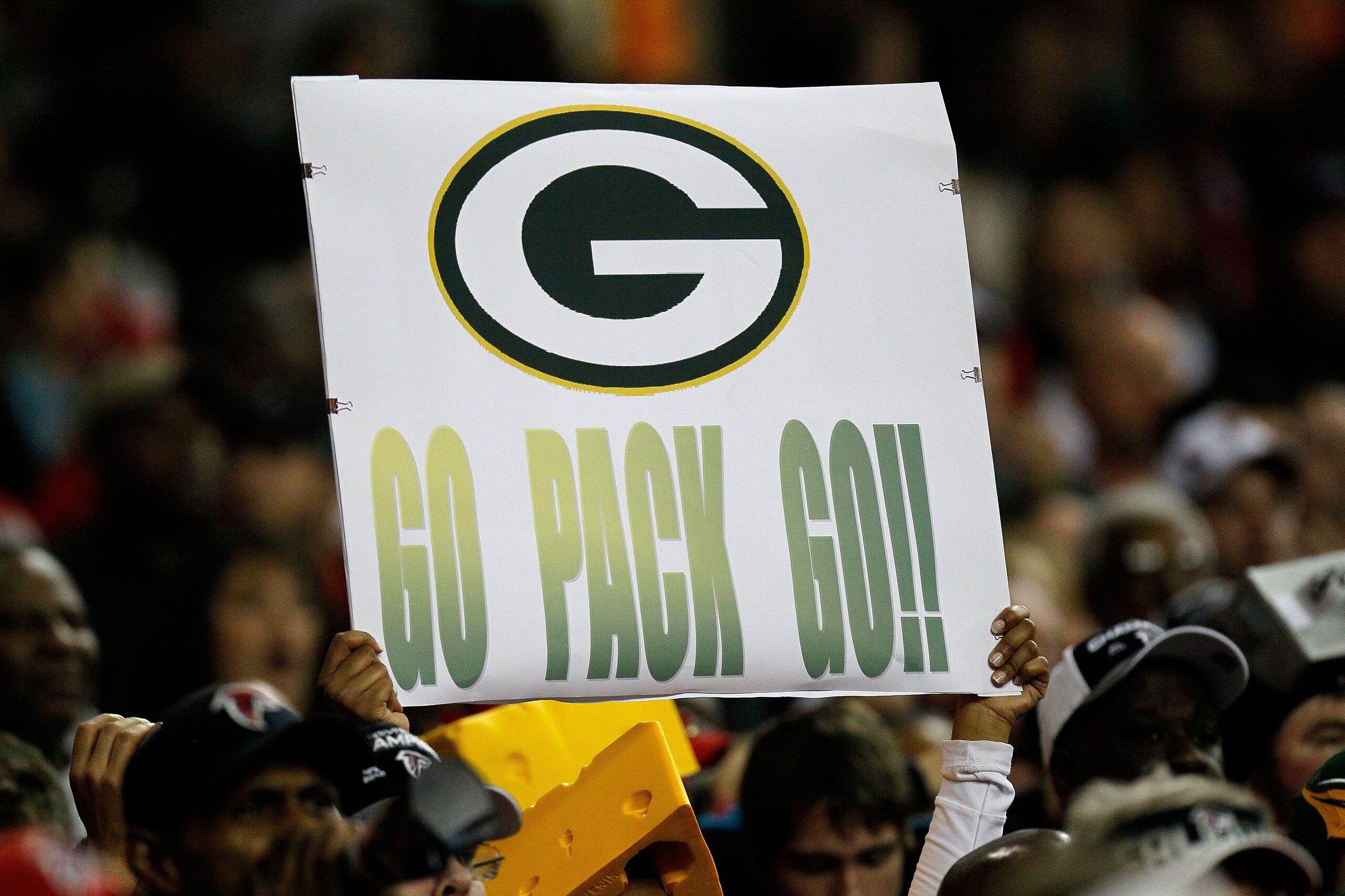 ATLANTA, GA - JANUARY 15:  A fan of the Green Bay Packers holds up a sign which reads 'Go Pack Go!' against the Atlanta Falcons during their 2011 NFC divisional playoff game at Georgia Dome on January 15, 2011 in Atlanta, Georgia. The Packers won 48-21. (