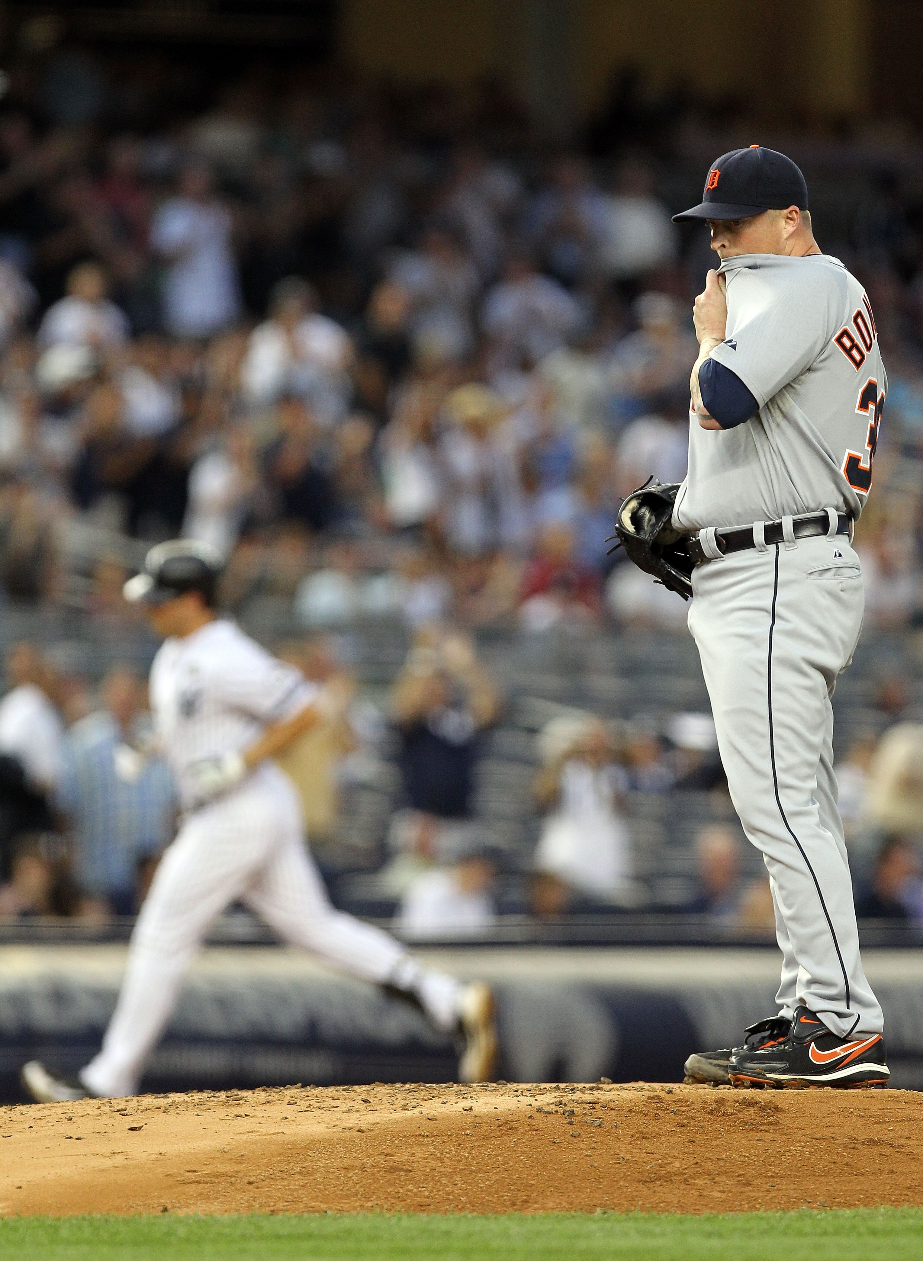 NEW YORK - AUGUST 18: Jeremy Bonderman #38 of the Detroit Tigers wipes his face as Mark Teixeira #25 of the New York Yankees rounds the bases at Yankee Stadium on August 18, 2010 in the Bronx borough of New York City. (Photo by Nick Laham/Getty Images) NEW YORK - AUGUST 18: Jeremy Bonderman #38 of the Detroit Tigers wipes his face as Mark Teixeira #25 of the New York Yankees rounds the bases at Yankee Stadium on August 18, 2010 in the Bronx borough of New York City. (Photo by Nick Laham/Getty Images)