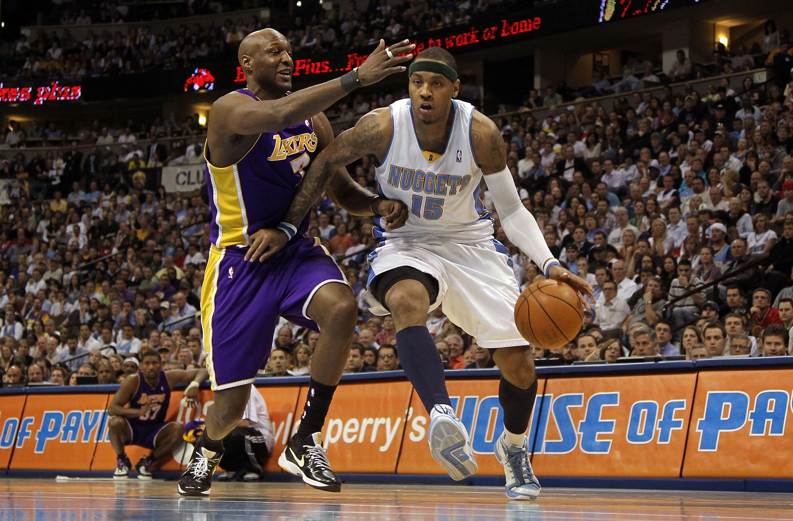 DENVER - APRIL 08: Carmelo Anthony #15 of the Denver Nuggets drives to the basket past Lamar Odom #7 of the Los Angeles Lakers during NBA action at the Pepsi Center on April 8, 2010 in Denver, Colorado. The Nuggets defeated the Lakers 98-96. NOTE TO USER DENVER - APRIL 08: Carmelo Anthony #15 of the Denver Nuggets drives to the basket past Lamar Odom #7 of the Los Angeles Lakers during NBA action at the Pepsi Center on April 8, 2010 in Denver, Colorado. The Nuggets defeated the Lakers 98-96. NOTE TO USER