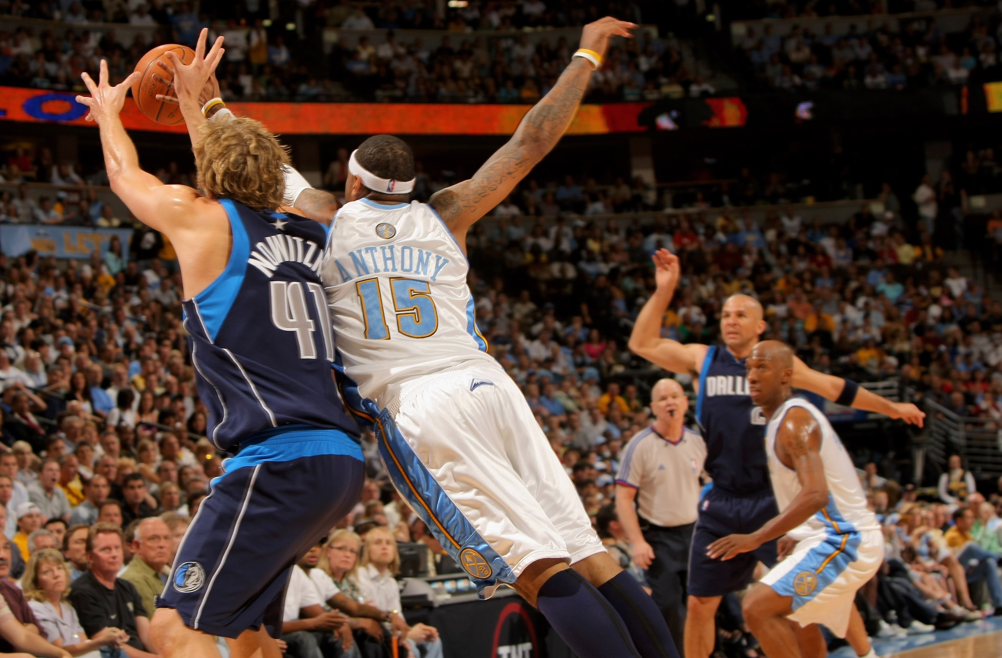 DENVER - MAY 13:  Carmelo Anthony #15 of the Denver Nuggets knocks away a pass intended for Dirk Nowitzki #41 from Jason Kidd #2 of the Dallas Mavericks in Game Five of the Western Conference Semifinals during the 2009 NBA Playoffs at Pepsi Center on May