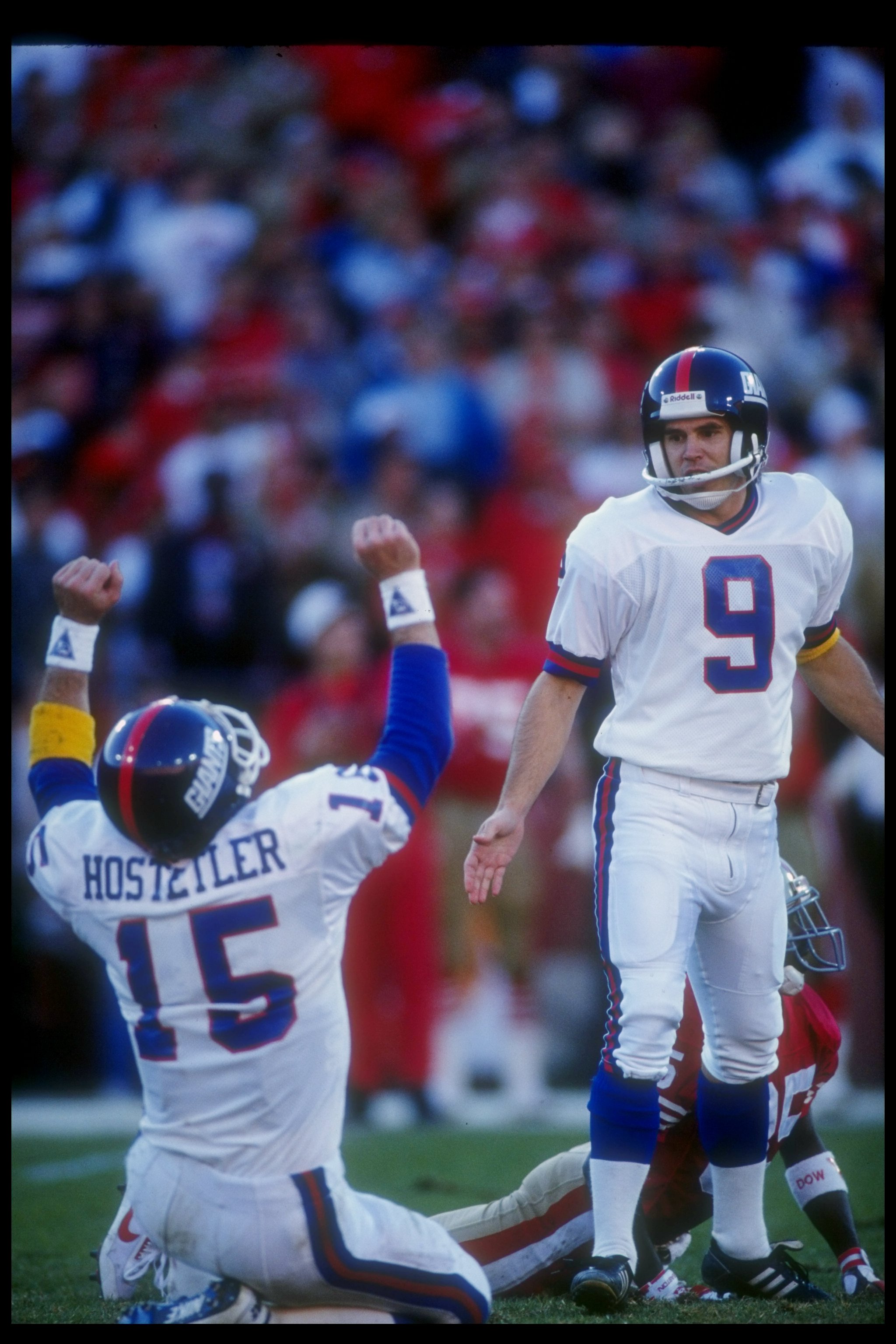 20 Jan 1991:  Quarterback Jeff Hostetler of the New York Giants (left) celebrates after kicker Matt Bahr kicked the winning field goal during a playoff game against the San Francisco 49ers at Candlestick Park in San Francisco, California.  The Giants won