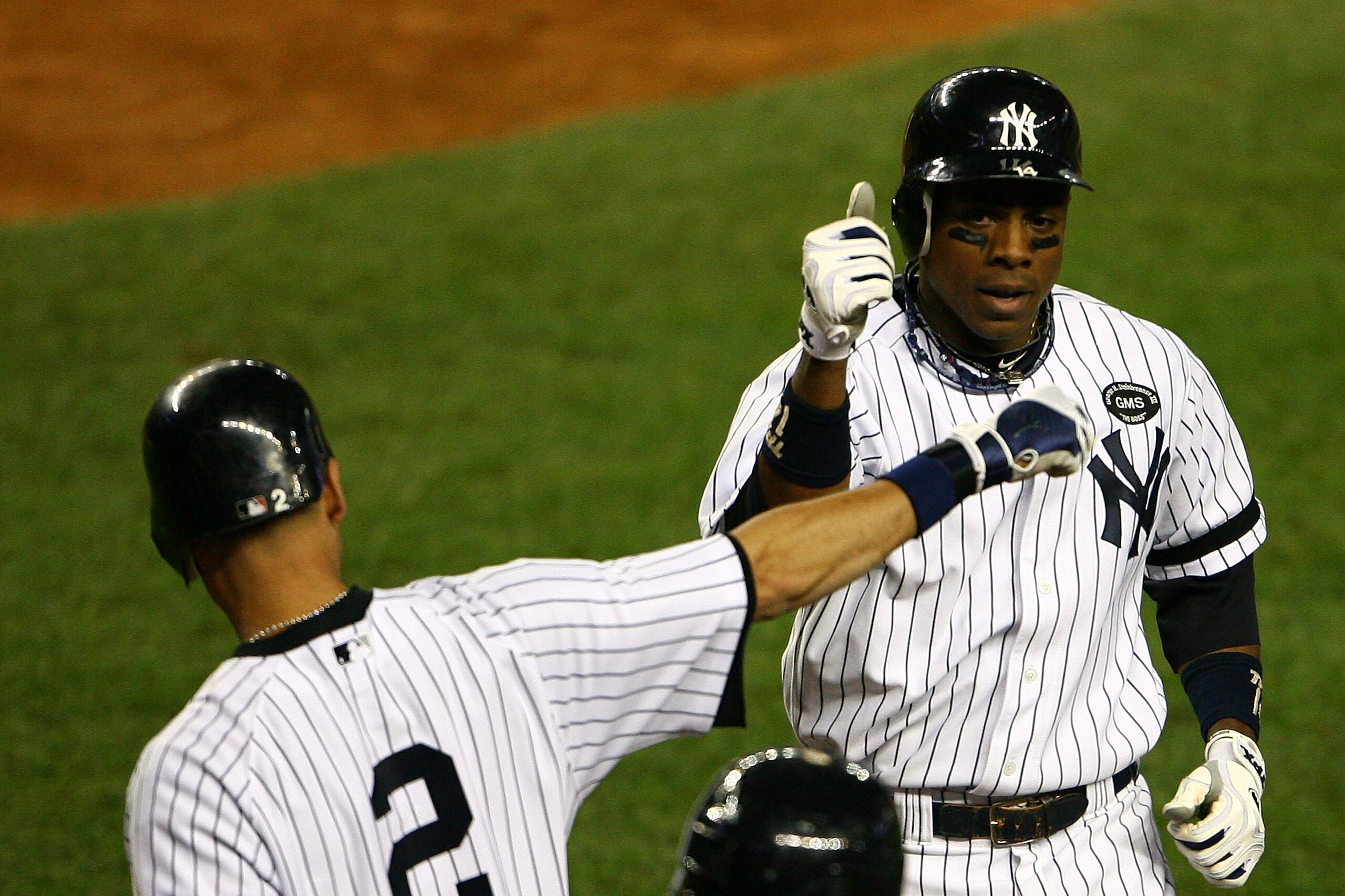 NEW YORK - OCTOBER 20: Curtis Granderson #14 of the New York Yankees celebrates with Derek Jeter #2 after Granderson hit a solo home run in the bottom of the eighth inning against the Texas Rangers in Game Five of the ALCS during the 2010 MLB Playoffs at NEW YORK - OCTOBER 20: Curtis Granderson #14 of the New York Yankees celebrates with Derek Jeter #2 after Granderson hit a solo home run in the bottom of the eighth inning against the Texas Rangers in Game Five of the ALCS during the 2010 MLB Playoffs at