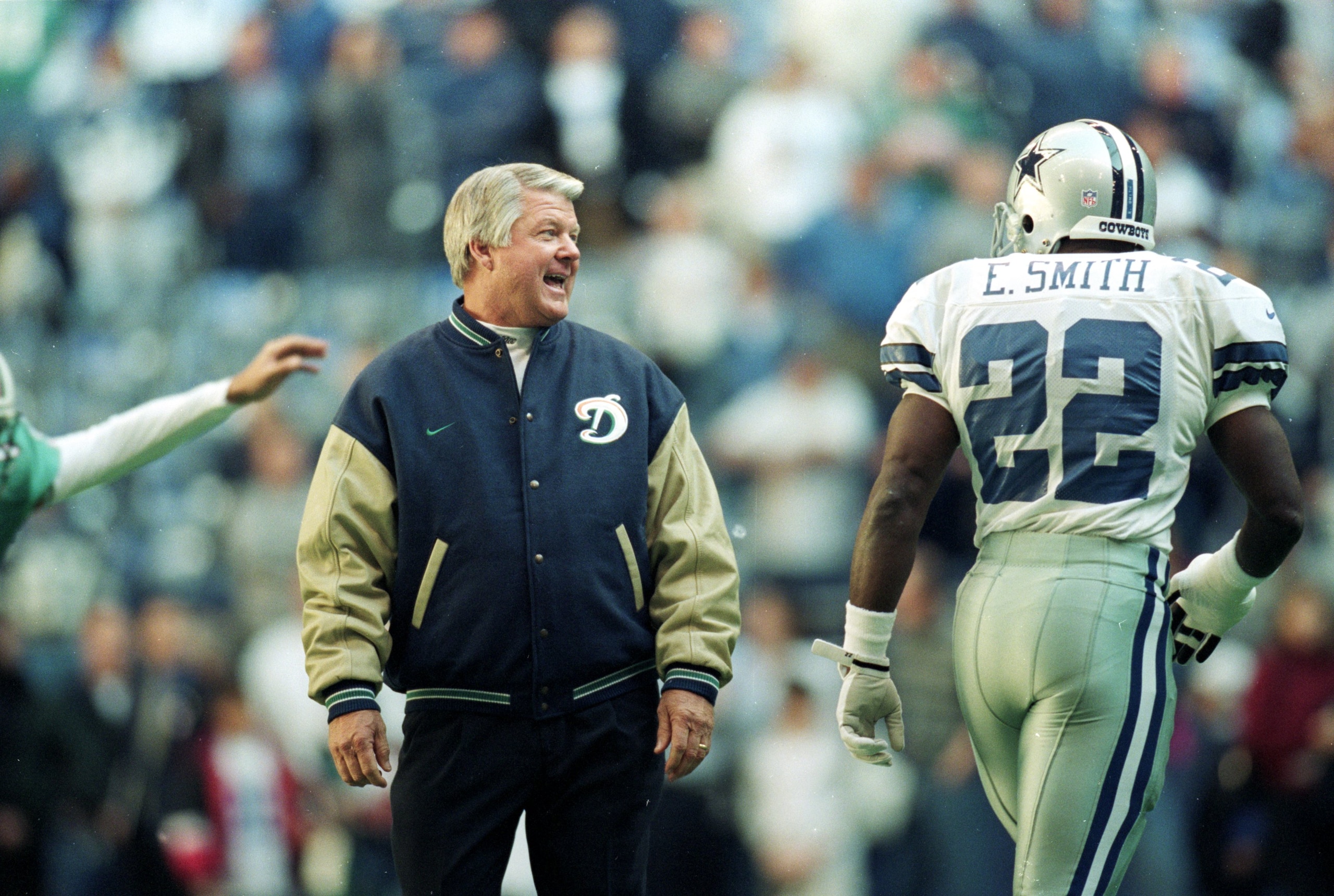 25 Nov 1999: Coach Jimmy Johnson of the Miami Dolphins talks to Emmitt Smith #22 of the Dallas Cowboys as he walks onto the field during the game at the Texas Stadium in Irving, Texas. The Cowboys defeated the Dolphins 20-0. 25 Nov 1999: Coach Jimmy Johnson of the Miami Dolphins talks to Emmitt Smith #22 of the Dallas Cowboys as he walks onto the field during the game at the Texas Stadium in Irving, Texas. The Cowboys defeated the Dolphins 20-0.