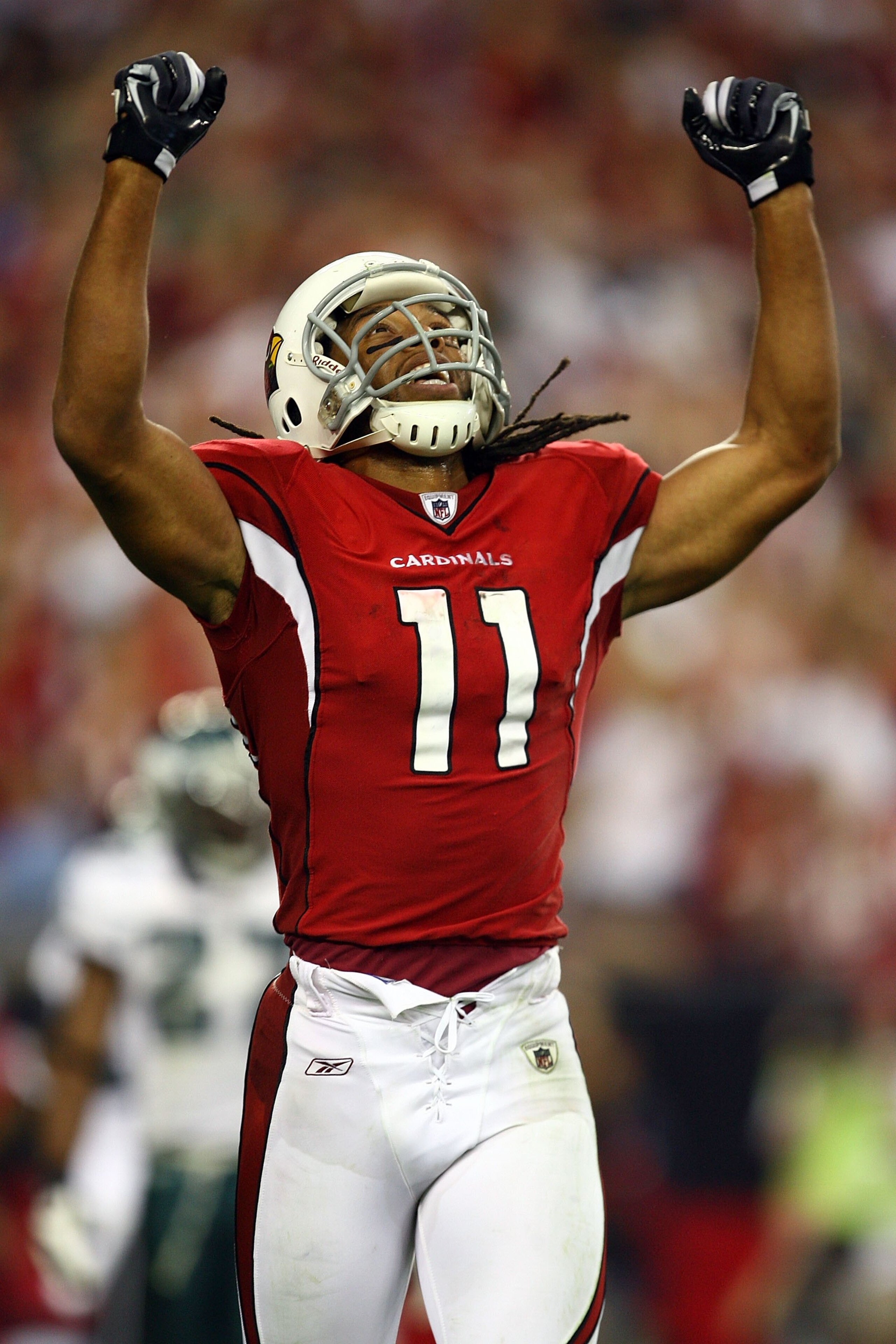GLENDALE, AZ - JANUARY 18: Wide receiver Larry Fitzgerald #11 of the Arizona Cardinals reacts after teammate Tim Hightower #34 scored a touchdown in the fourth quarter against the Philadelphia Eagles during the NFC championship game on January 18, 2009 a GLENDALE, AZ - JANUARY 18: Wide receiver Larry Fitzgerald #11 of the Arizona Cardinals reacts after teammate Tim Hightower #34 scored a touchdown in the fourth quarter against the Philadelphia Eagles during the NFC championship game on January 18, 2009 a