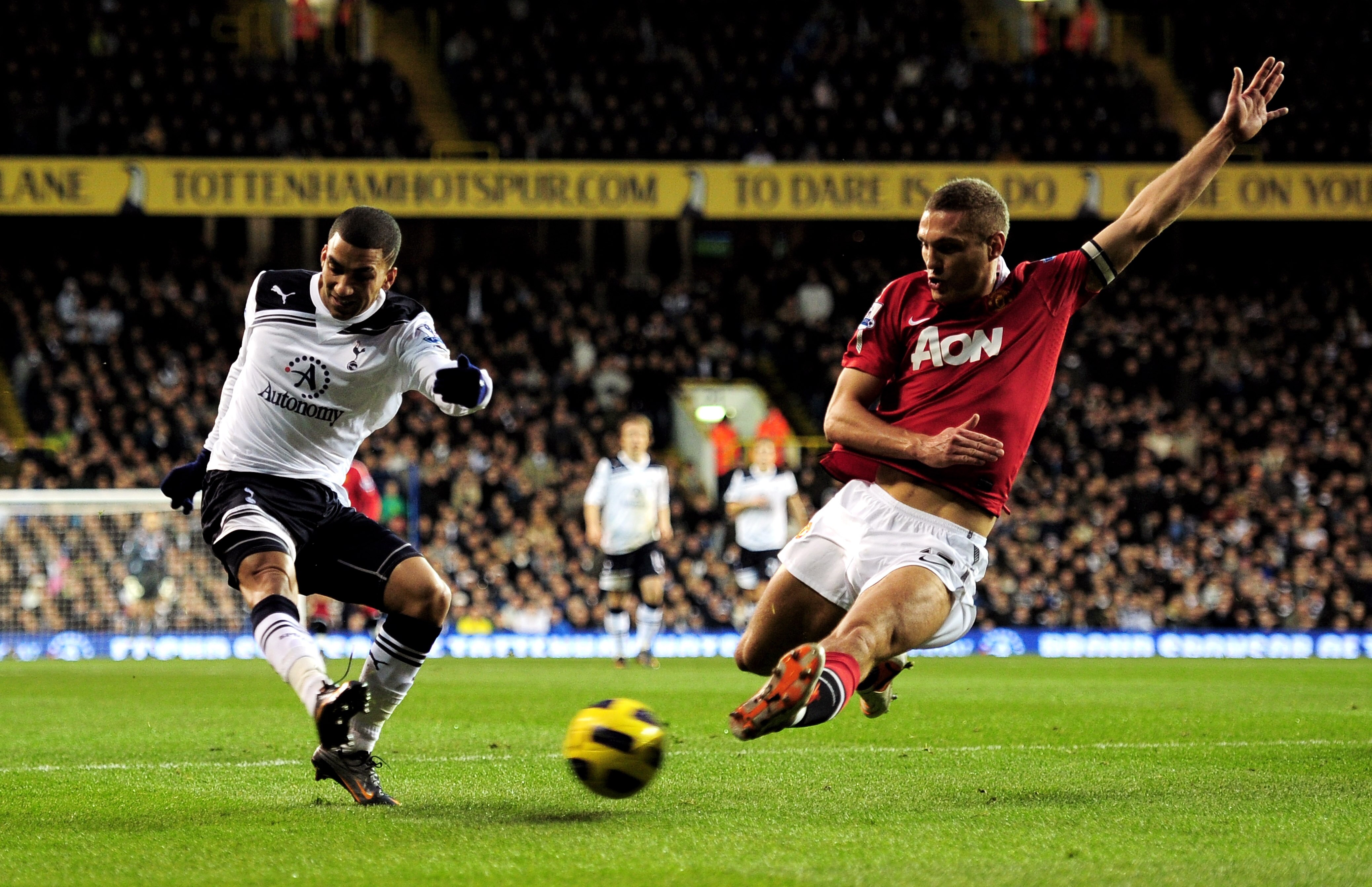 LONDON, ENGLAND - JANUARY 16:  Aaron Lennon of Spurs attempts to cross the ball as Nemanja Vidic of Manchester United closes in during the Barclays Premier League match between Tottenham Hotspur and Manchester United at White Hart Lane on January 16, 2011