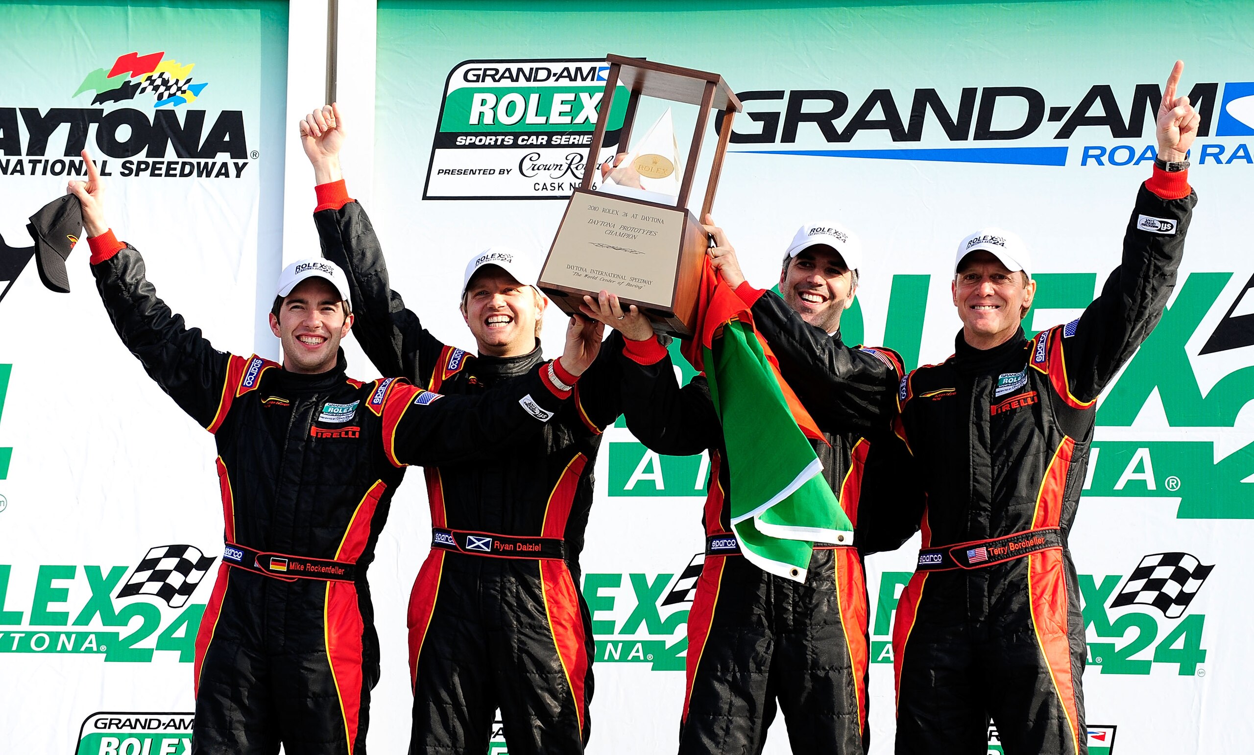 DAYTONA BEACH, FL - JANUARY 31: Terry Borcheller, Joao Barbosa, Mike Rockenfeller, and Ryan Dalziel, drivers of the #9 Action Express Racing Porsche Riley, display the trophy after winning the DP Class of the Grand-Am Rolex 24 at Daytona held at Daytona DAYTONA BEACH, FL - JANUARY 31: Terry Borcheller, Joao Barbosa, Mike Rockenfeller, and Ryan Dalziel, drivers of the #9 Action Express Racing Porsche Riley, display the trophy after winning the DP Class of the Grand-Am Rolex 24 at Daytona held at Daytona