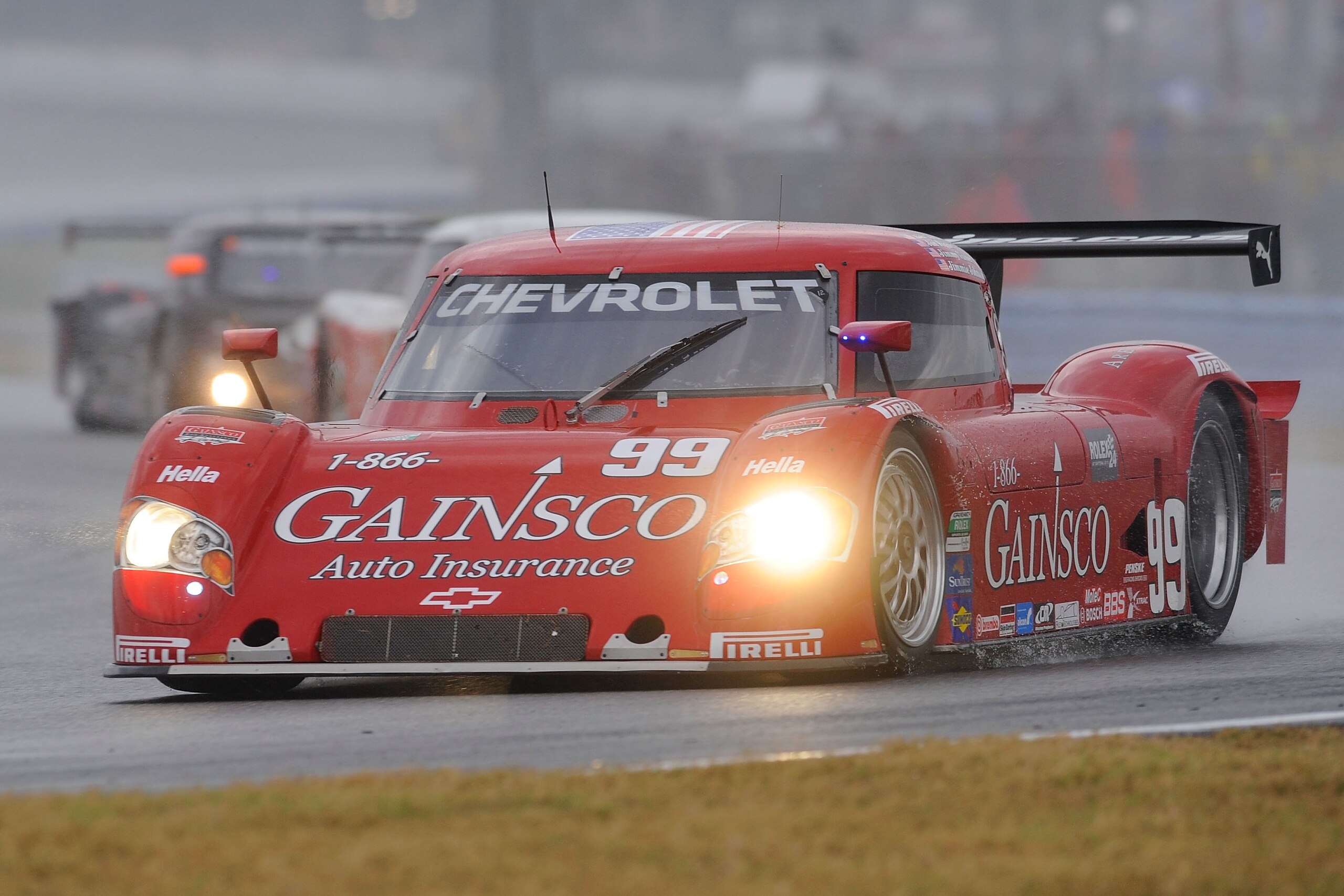 DAYTONA BEACH, FL - JANUARY 30: The #99 Car driven by drivers Jon Fogarty, Alex Gurney,Jimmy Vaser & Jimmie Johnson heads into the east Horseshoe during the Grand-Am Rolex 24 at Daytona held at Daytona International Speedway on January 30, 2010 in Dayton DAYTONA BEACH, FL - JANUARY 30: The #99 Car driven by drivers Jon Fogarty, Alex Gurney,Jimmy Vaser & Jimmie Johnson heads into the east Horseshoe during the Grand-Am Rolex 24 at Daytona held at Daytona International Speedway on January 30, 2010 in Dayton